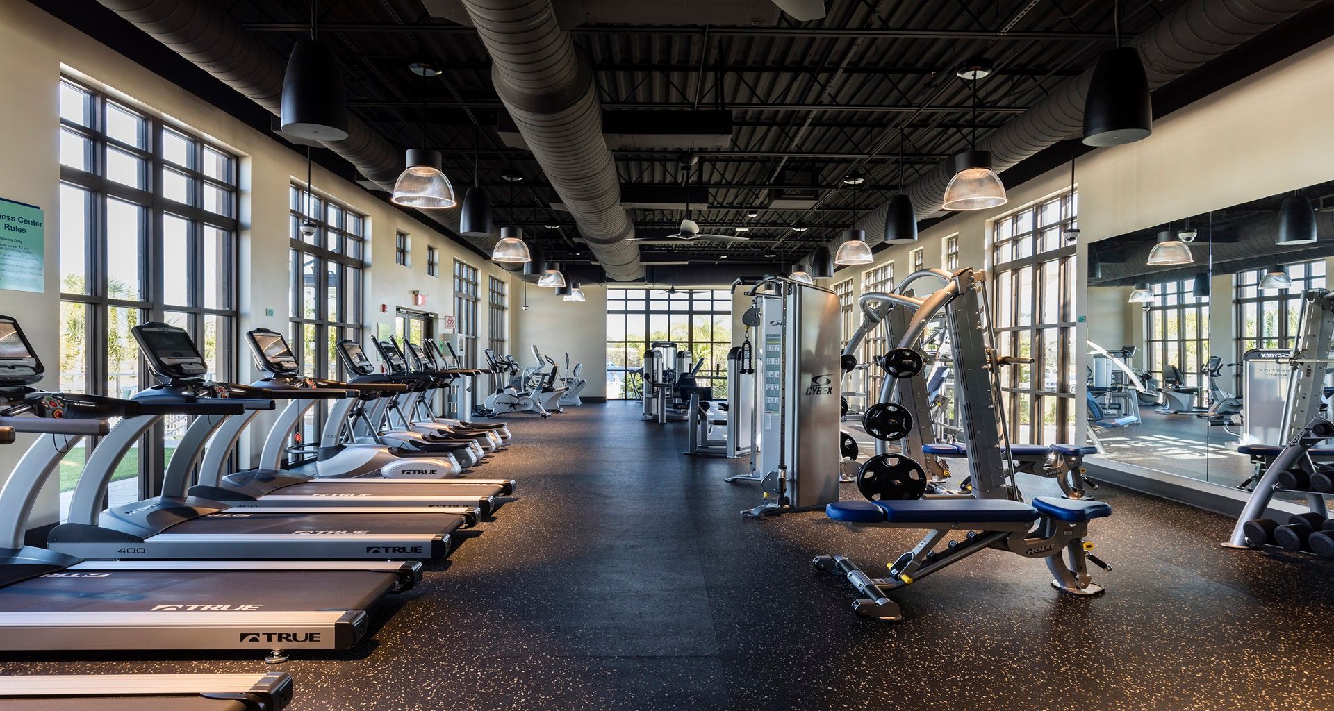 State-of-the-art gym with floor-to-ceiling windows and equipment!