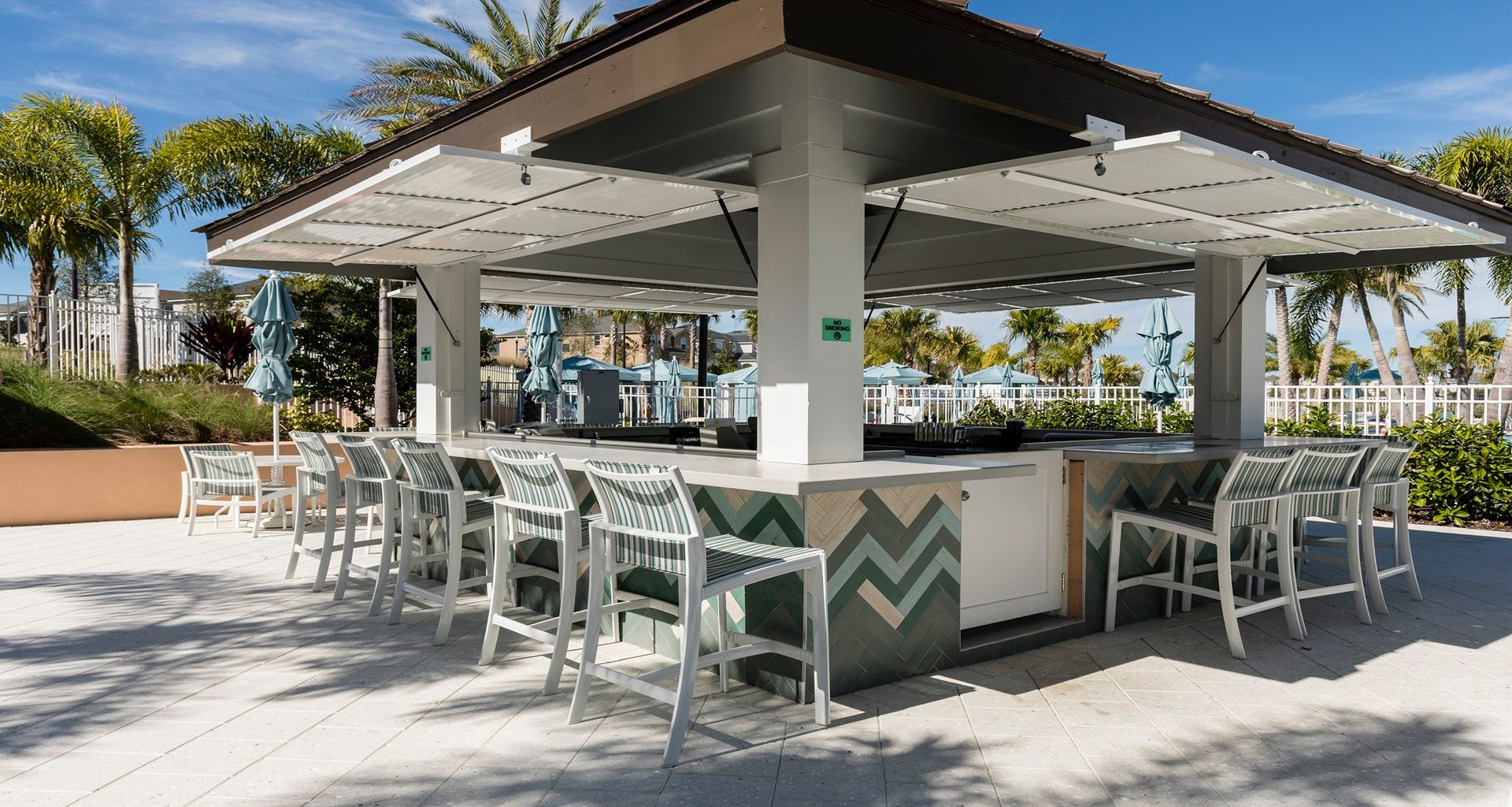 Poolside paradise! Enjoy refreshing drinks under the palm shade!