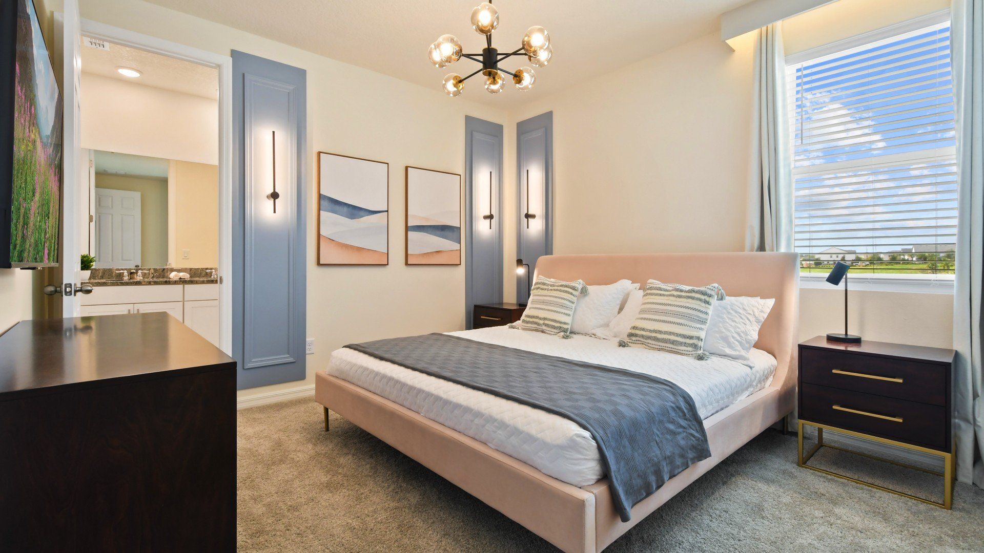 Elegant bedroom with a plush king bed, stylish lighting, and serene decor.