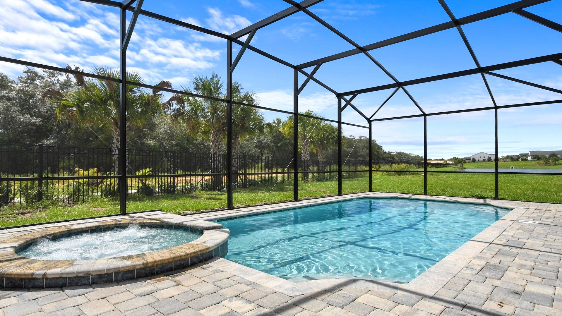 Screened Pool & Spa: Enjoy a private oasis with a screened pool and spa for a serene and refreshing retreat