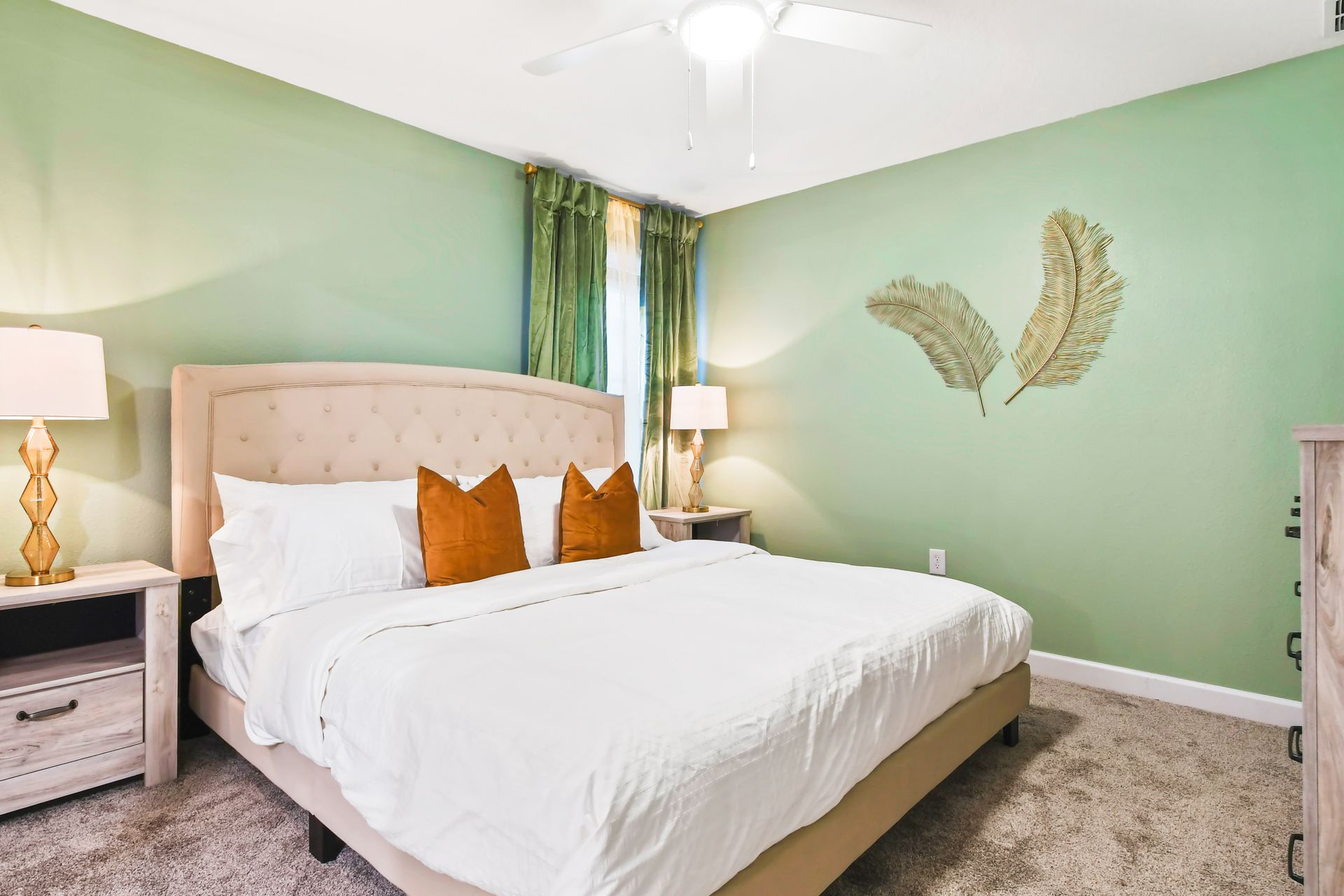 Serene bedroom with earthy green tones, plush bedding, and natural decor accents