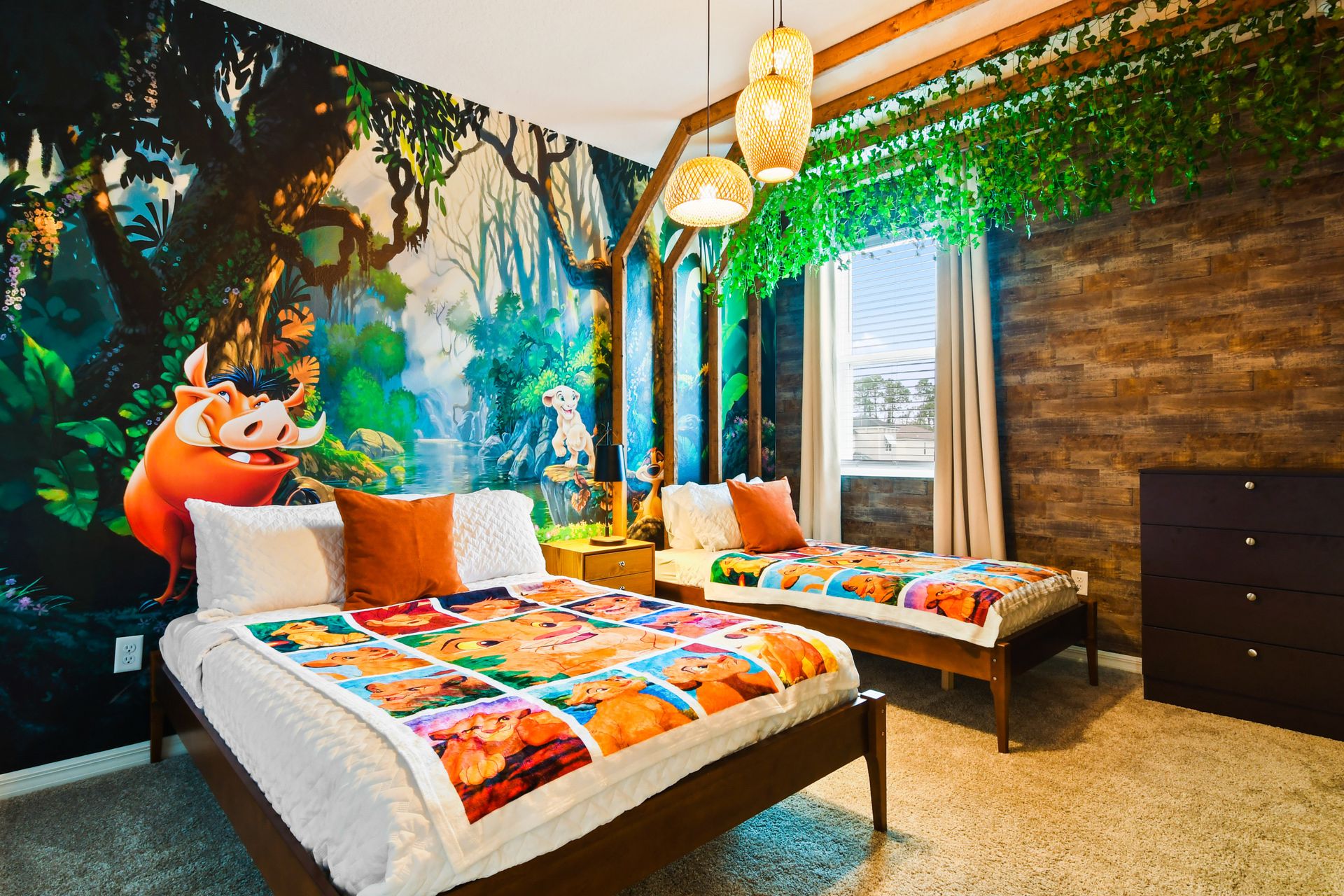 Jungle-themed bedroom with playful decor, twin beds, and vibrant wall art.