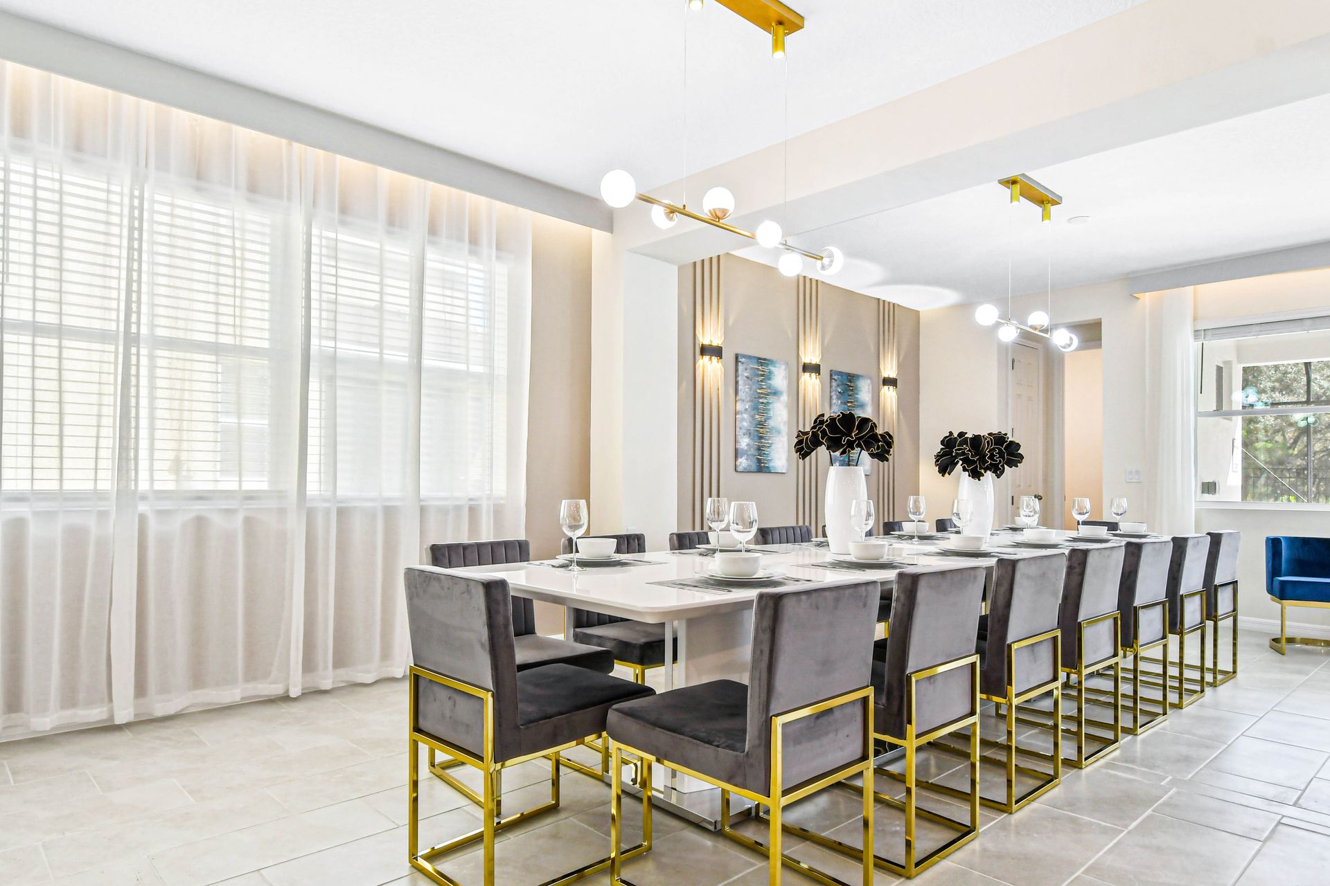 Bright, elegant dining space with seating for 10, modern lighting, and stylish decor.