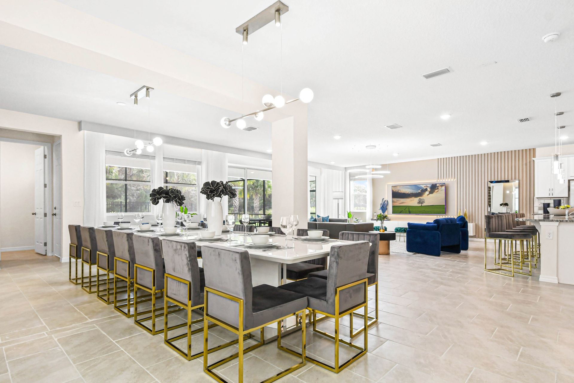 Spacious open-concept dining and living area with modern decor and natural light.