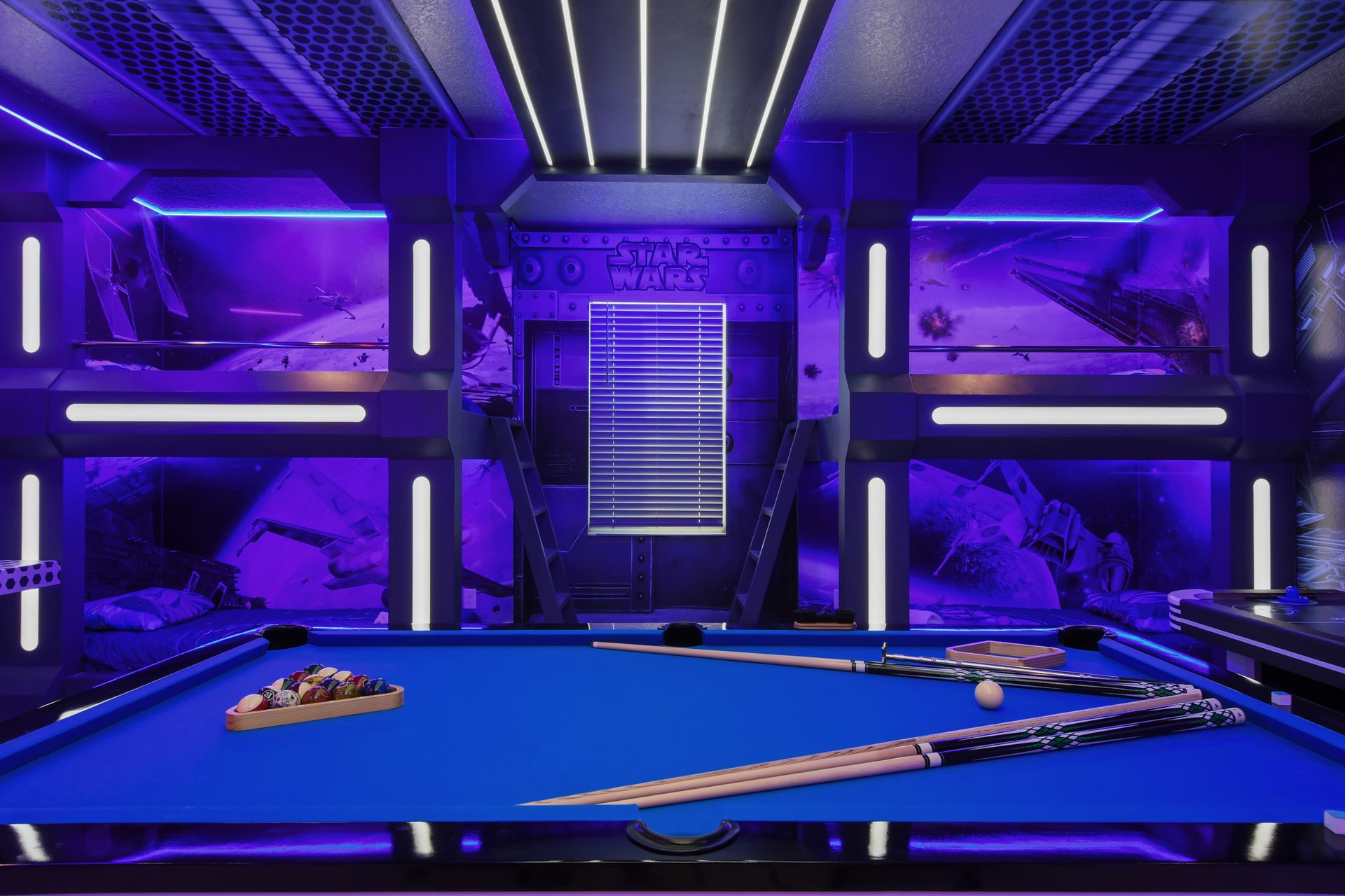Ultimate Star Wars gaming zone with consoles, themed decor, and a pool table