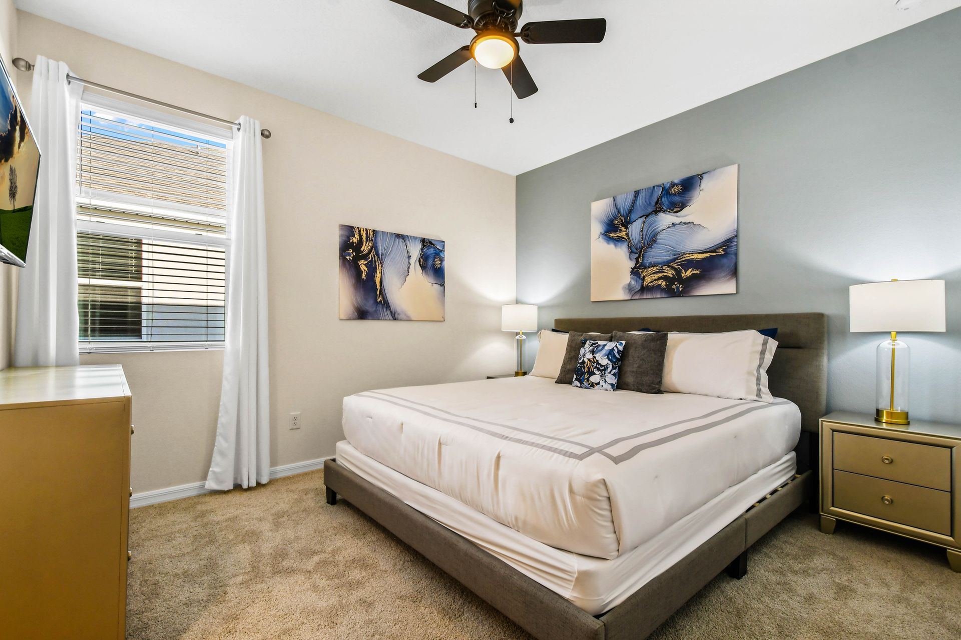 Elegant bedroom with soothing blue accents and luxurious bedding!