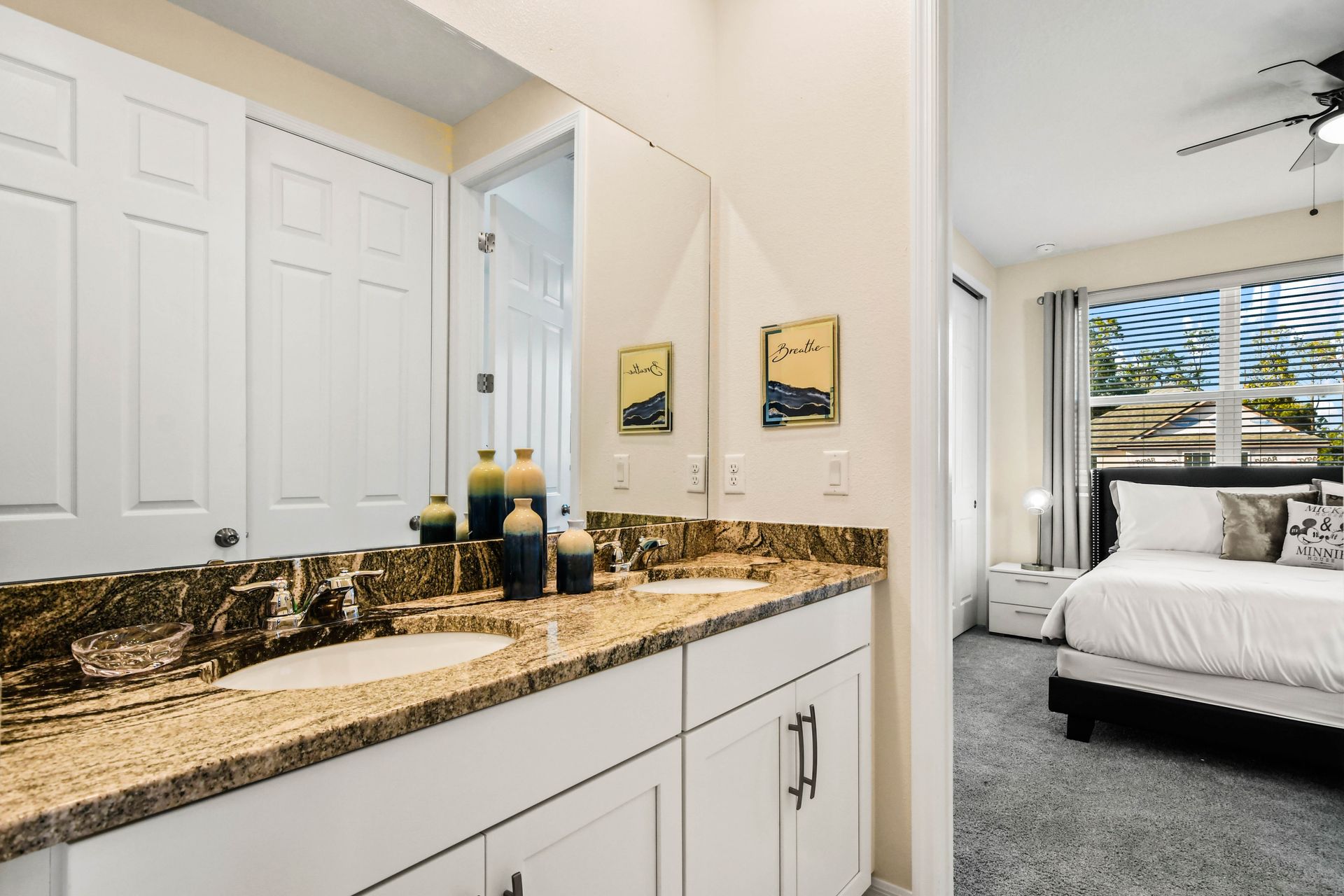Elegant bathroom with granite double vanity and private bedroom access!