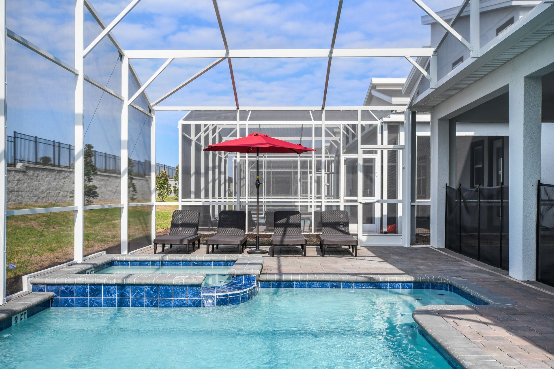 Soak up the sun by your private pool and spa with shaded loungers and screen.