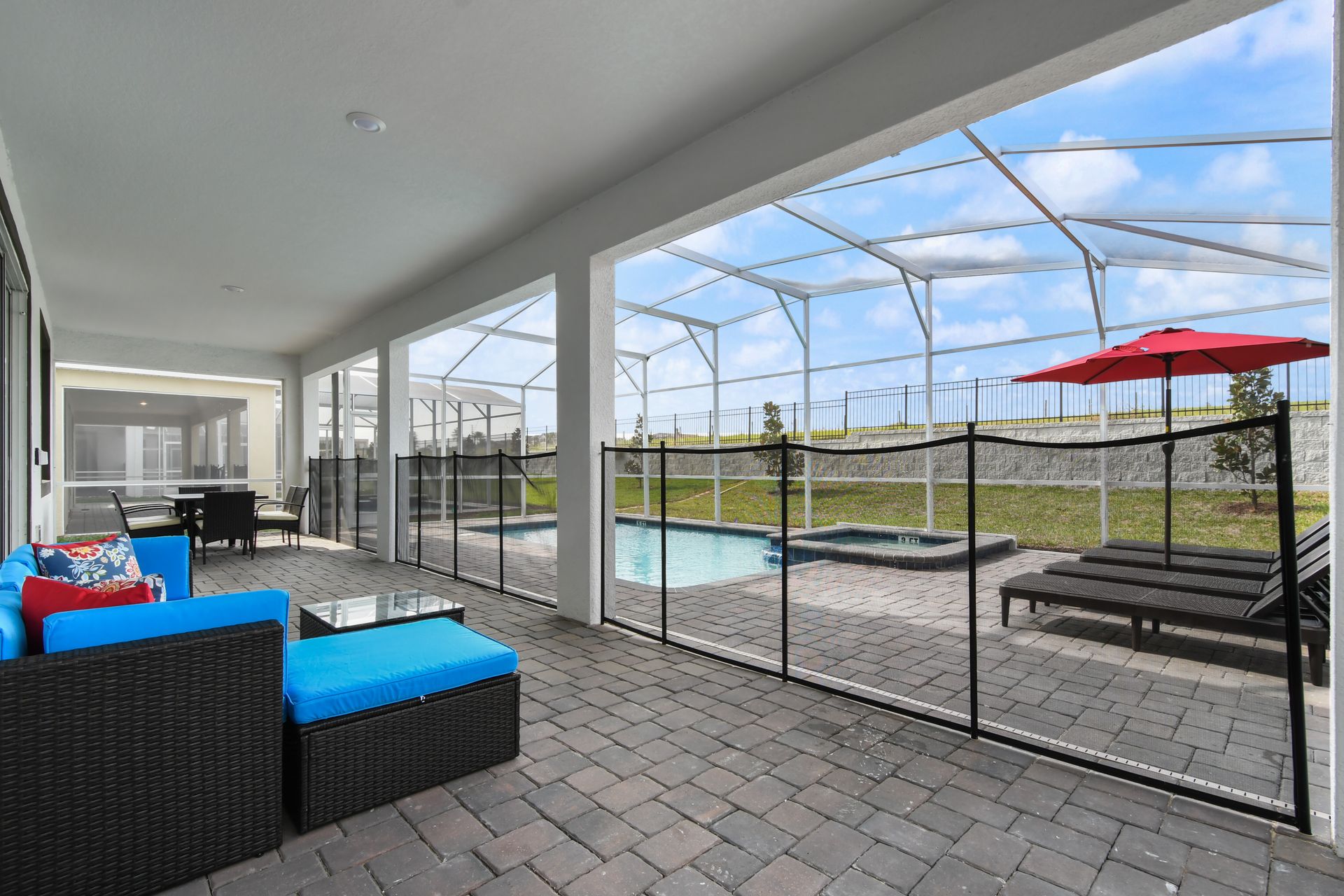 Relax by the pool in style with shaded seating, lounge chairs, and a hot tub.