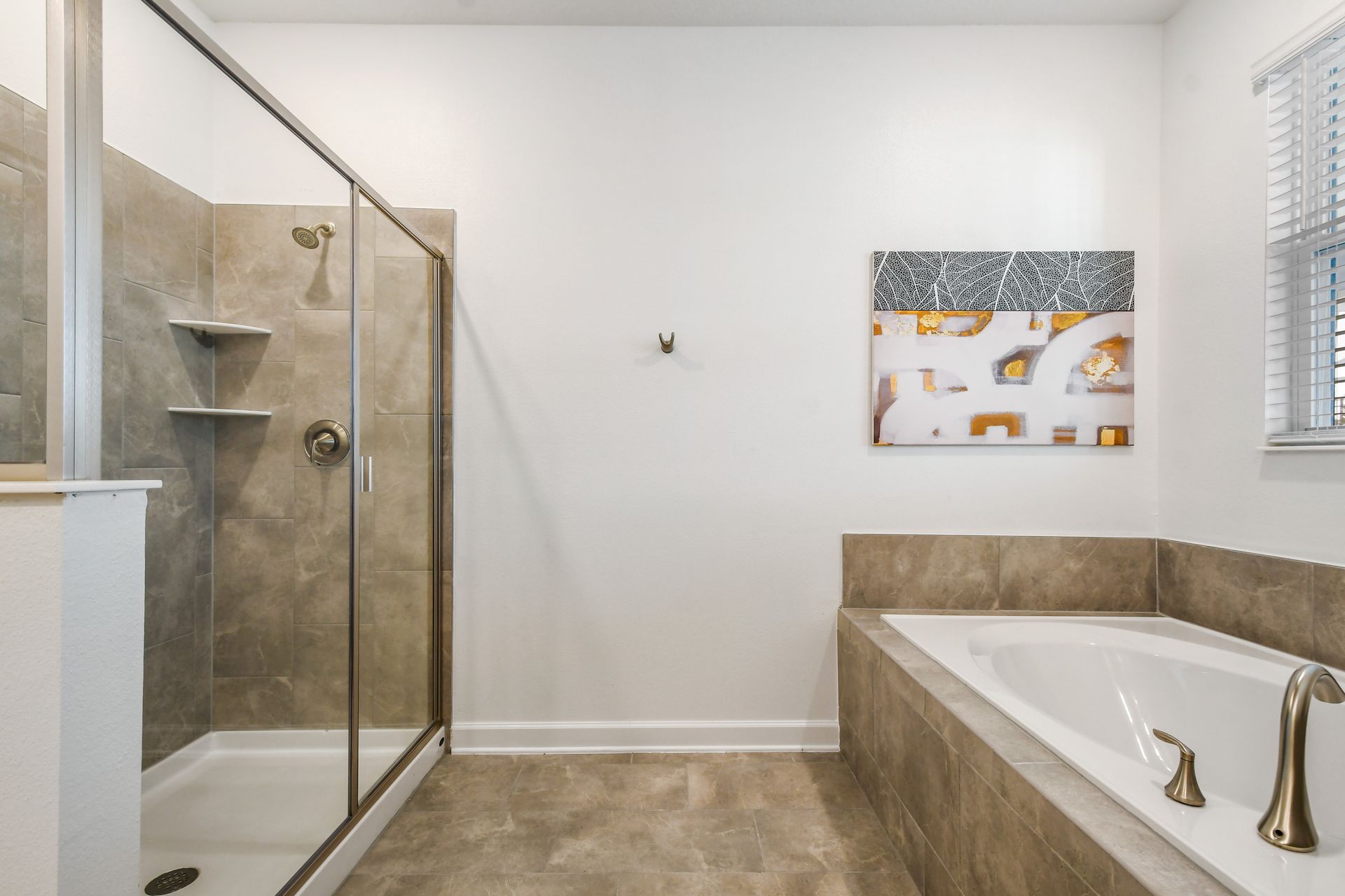 Spa-like bathroom with walk-in shower and soaking tub for total relaxation.
