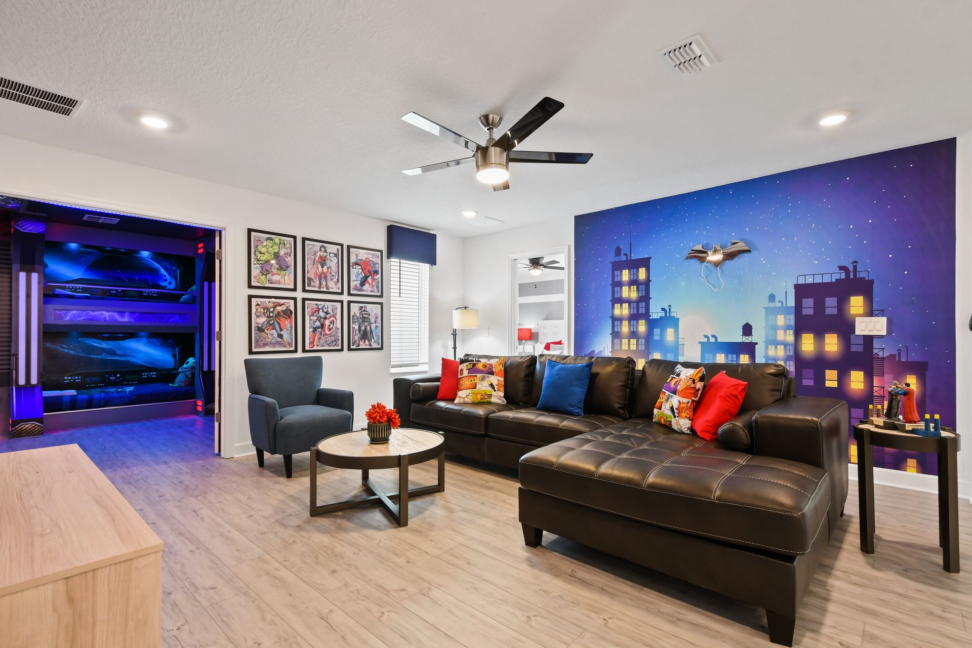 Hero-themed lounge with colorful decor, comic art, and cozy leather seating.