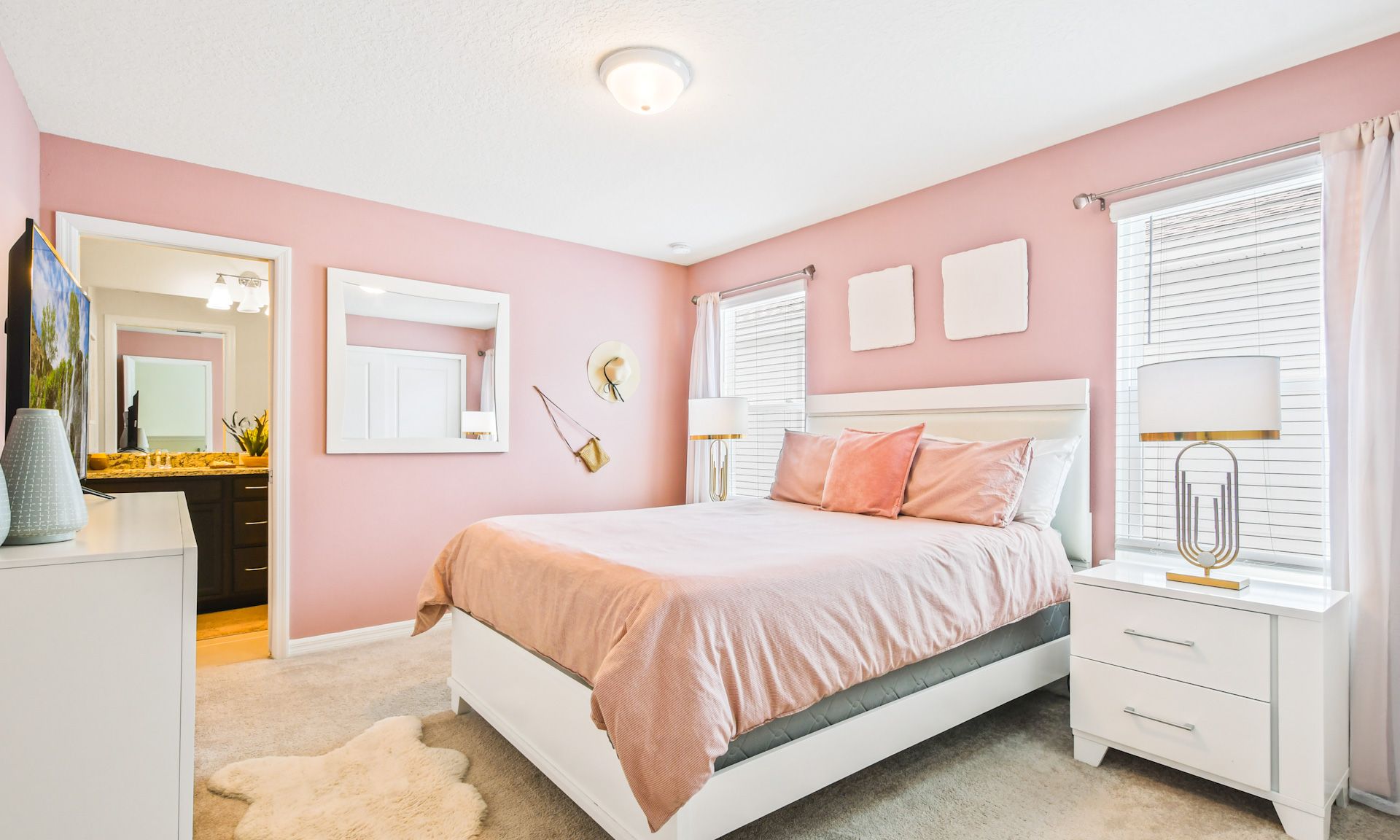 Pink power! Sweet dreams in this cozy bedroom with fluffy pillows.