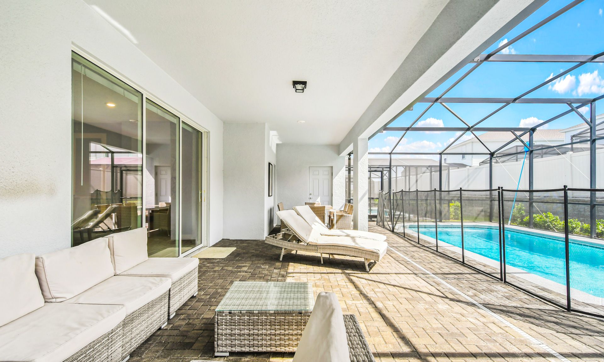 Poolside paradise! Dip, dine, and unwind on this inviting patio.