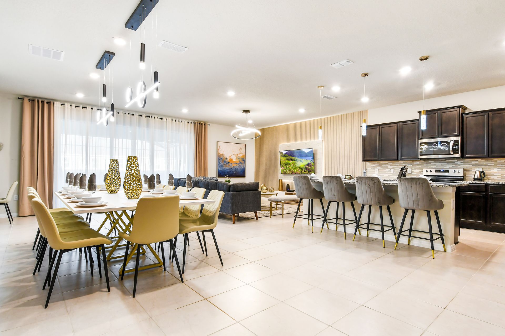 Elegant open-concept space with gourmet kitchen, spacious dining, and cozy lounge