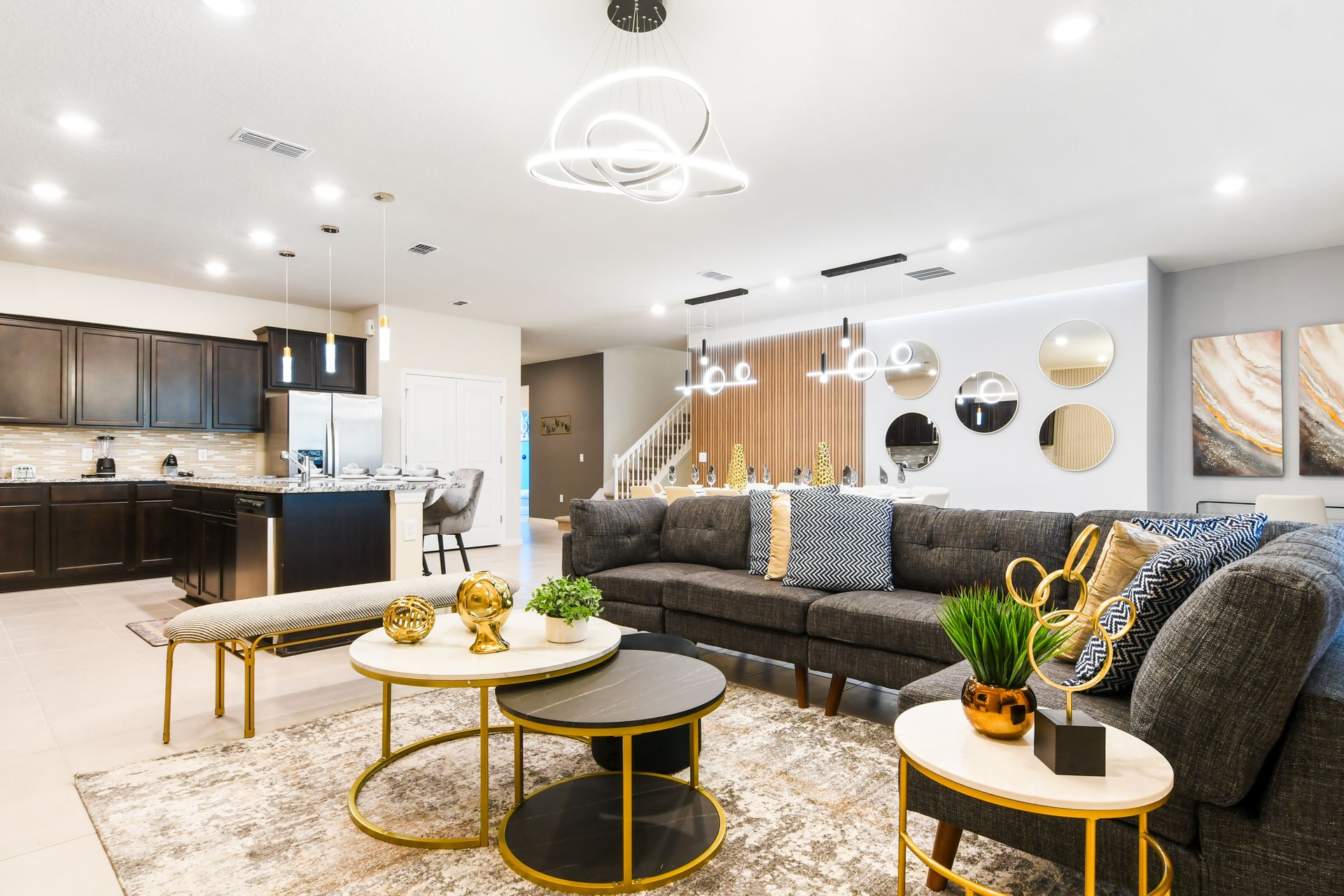 Spacious modern haven with designer kitchen, chic decor, and open social layout