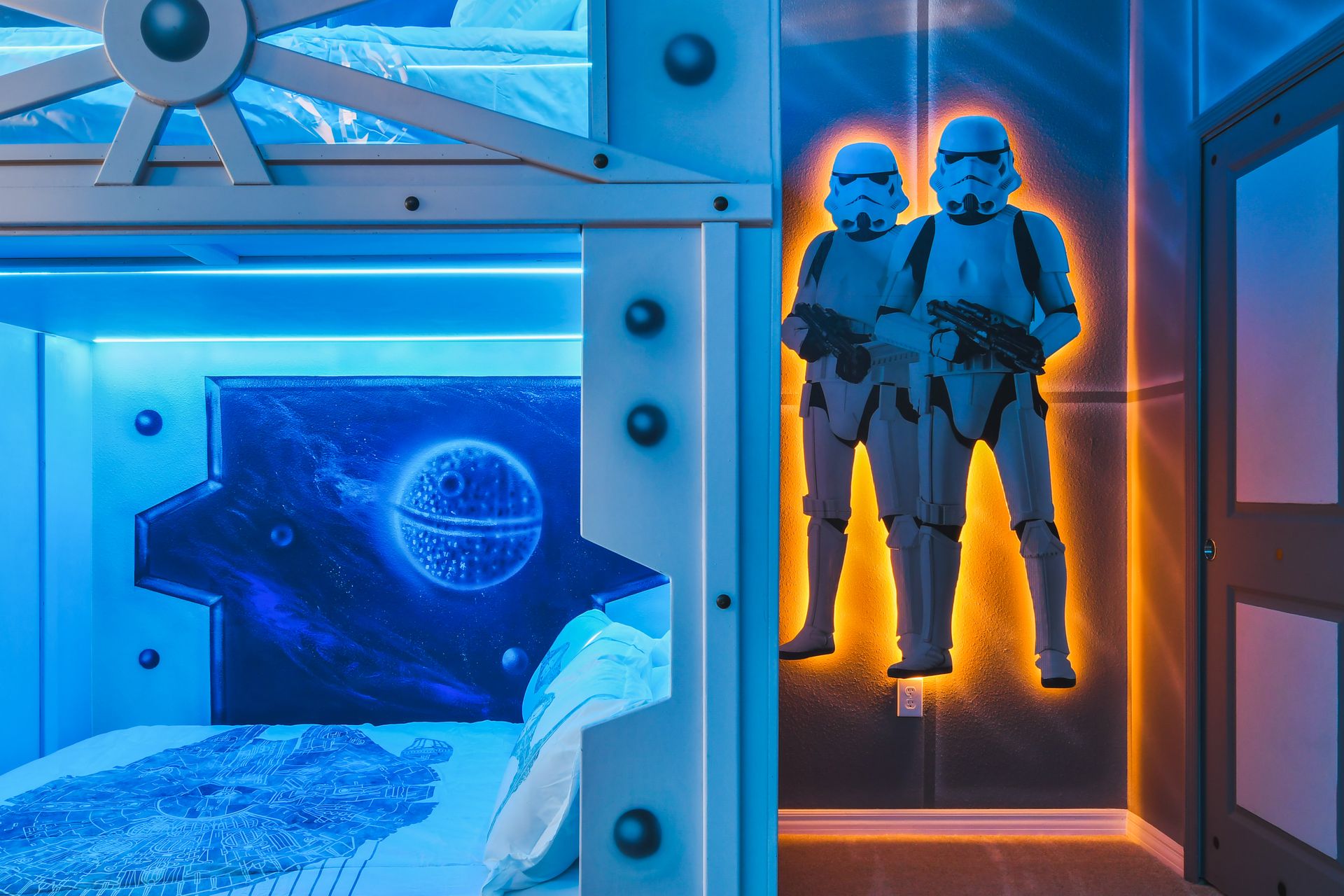 Epic galactic-themed bunk room with glowing lights, space art, and adventure vibes