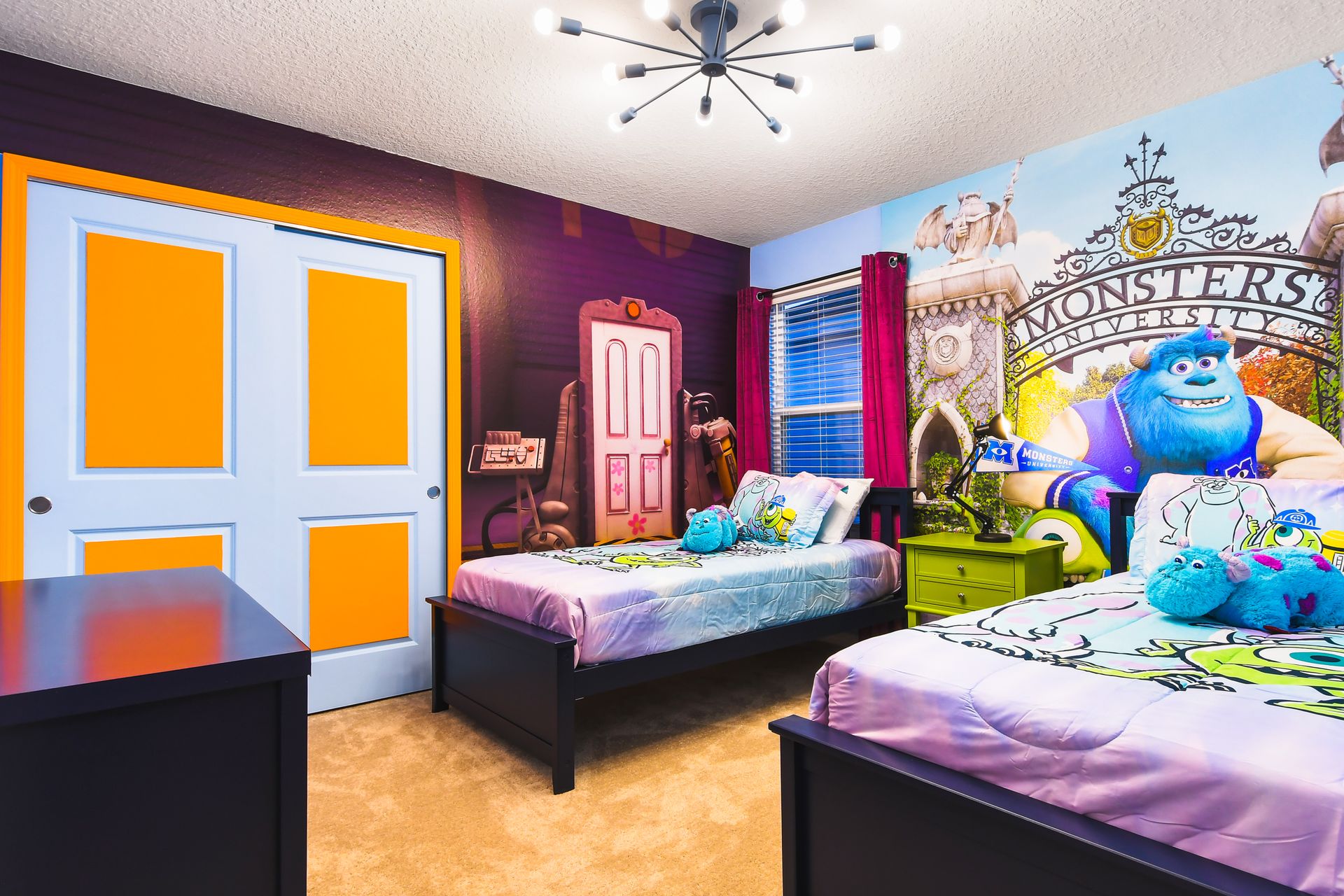 Fun Monsters-themed kids’ room with twin beds, colorful decor, and playful mural