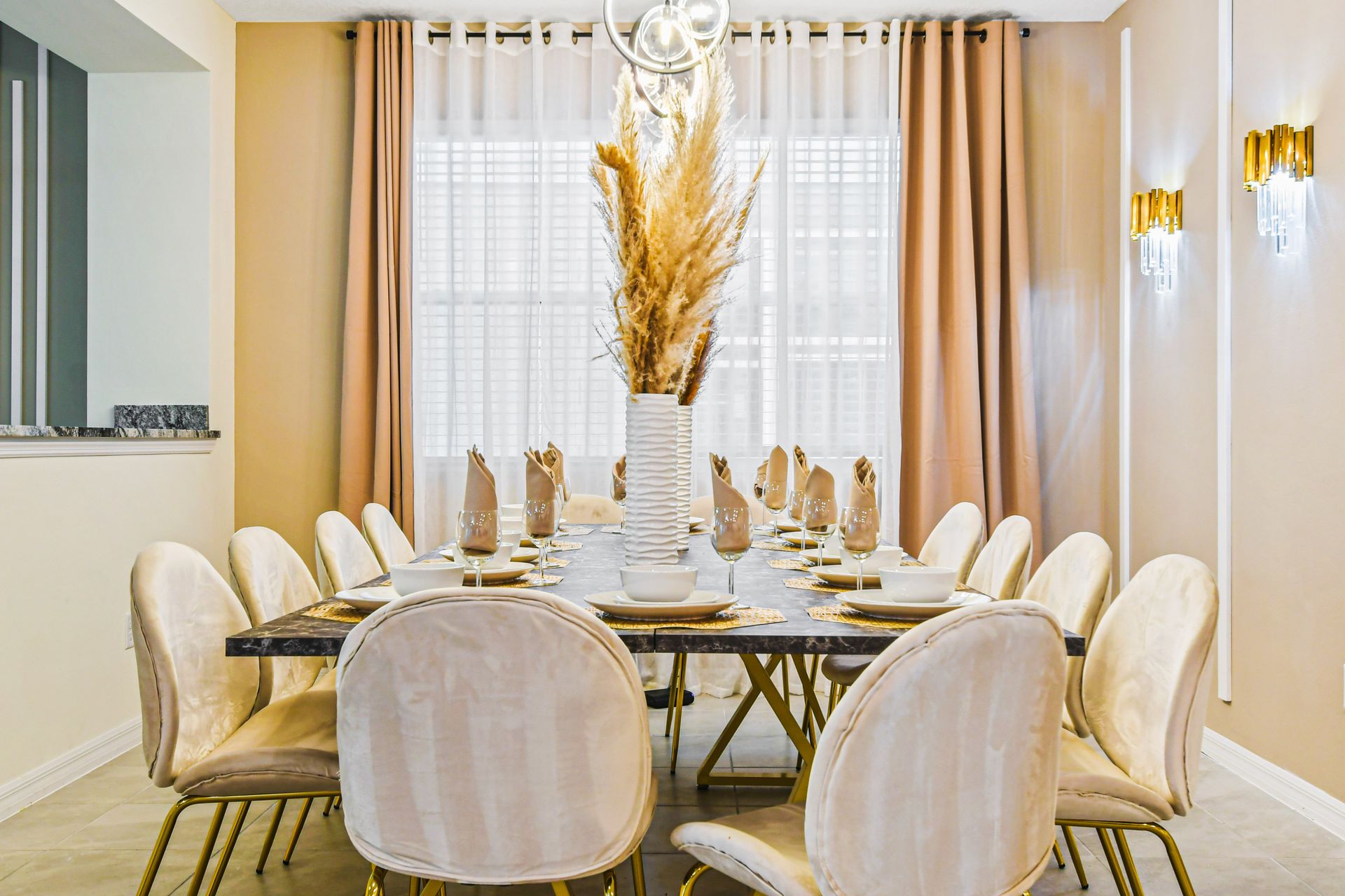 Chic dining space with elegant seating, gold accents, and charm!