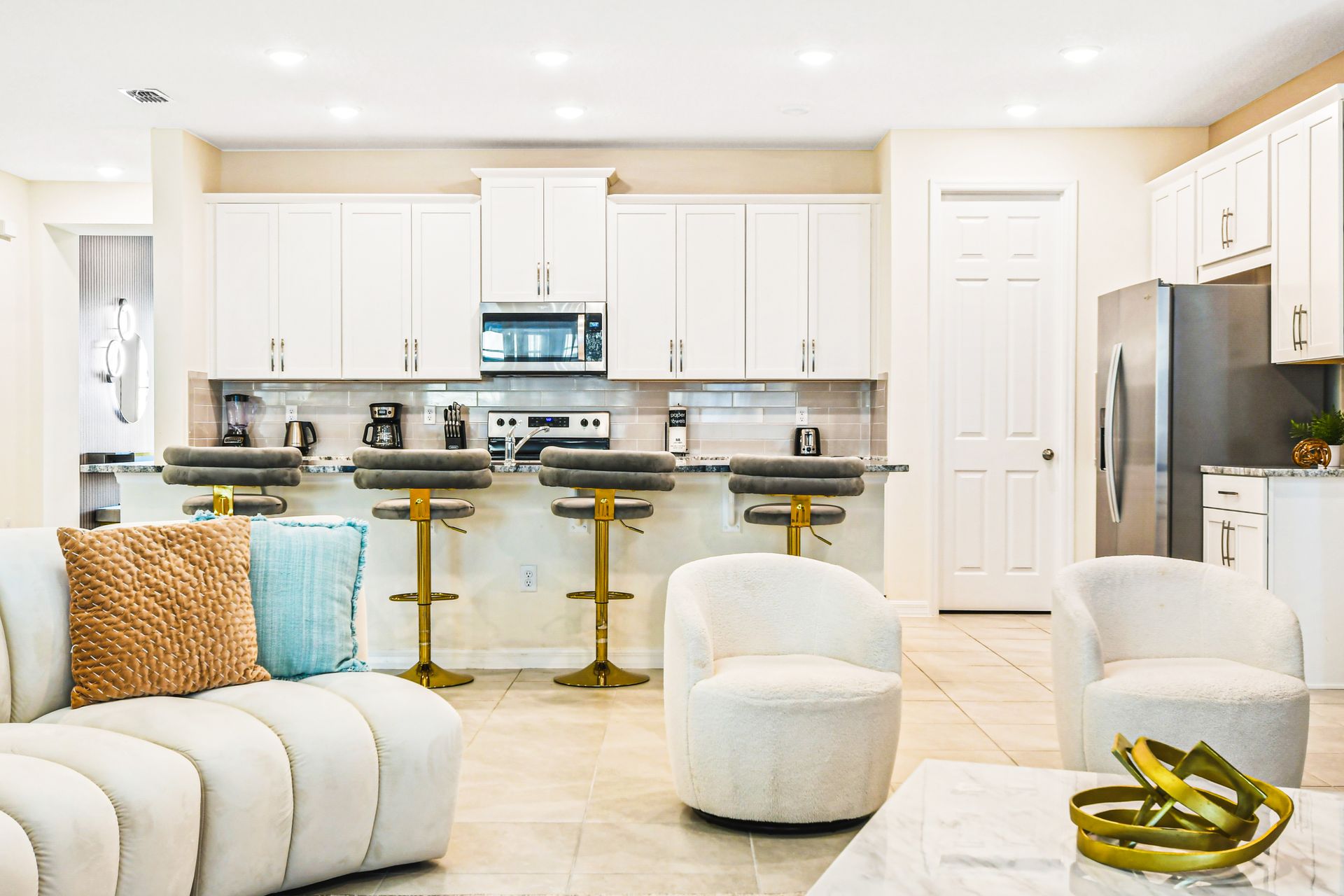 Bright modern kitchen with bar seating, perfect for gathering!