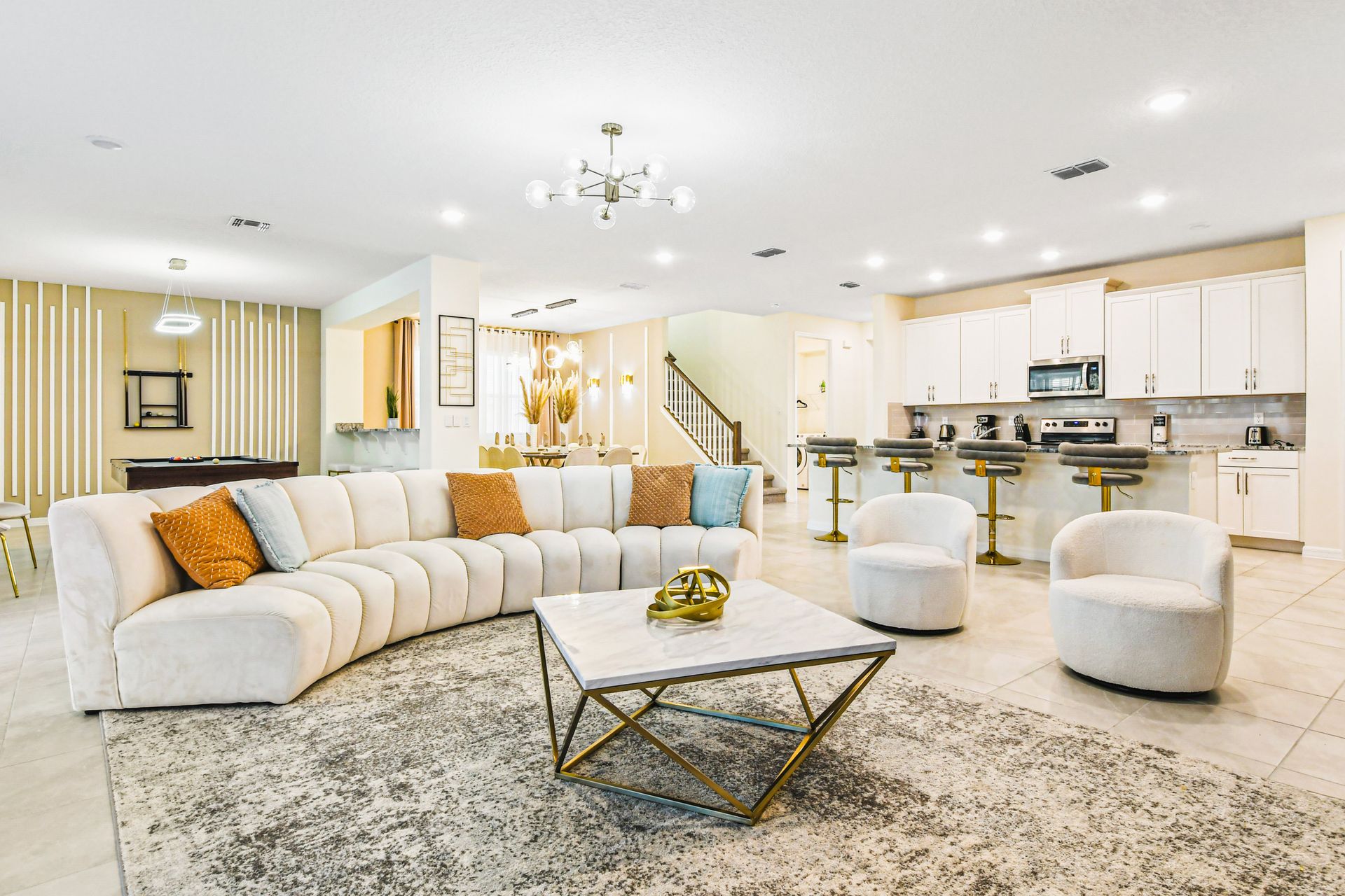 Spacious living room includes comfortable couches, perfect for a movie night.