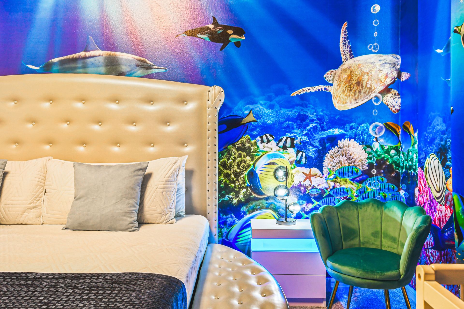 Underwater-themed bedroom with vibrant ocean mural and cozy vibes!