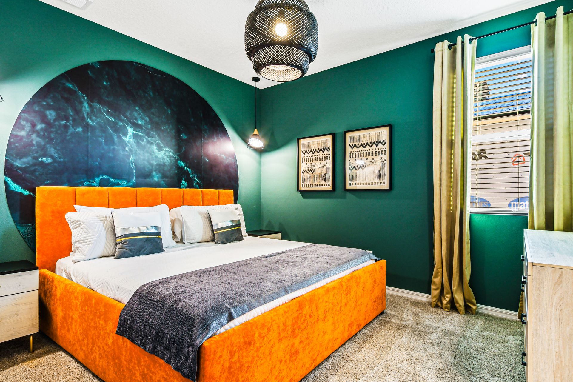 Bold and modern bedroom with vibrant orange bed and chic decor!