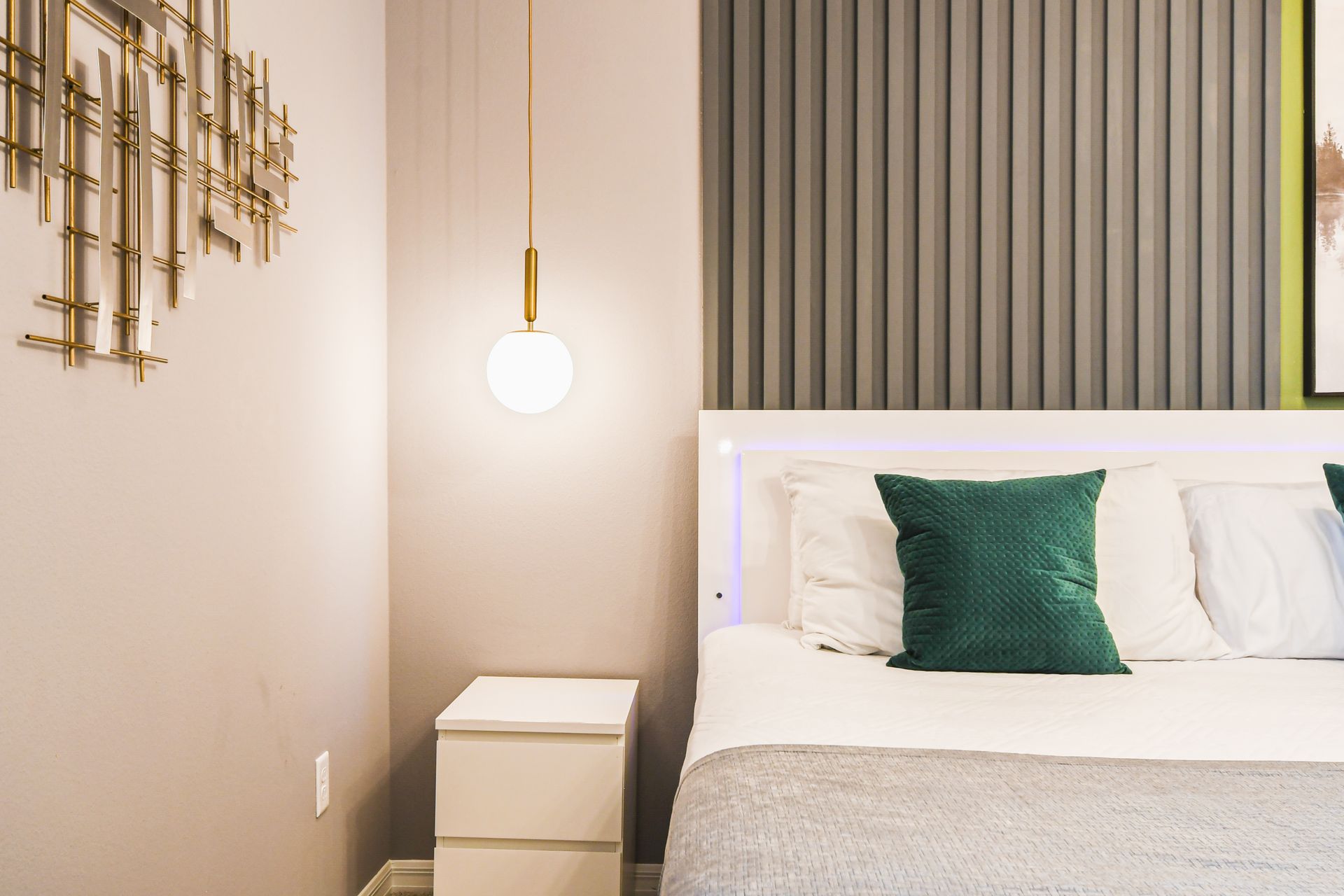 Elegant bedroom with modern accents, pendant lighting, and cozy vibes!