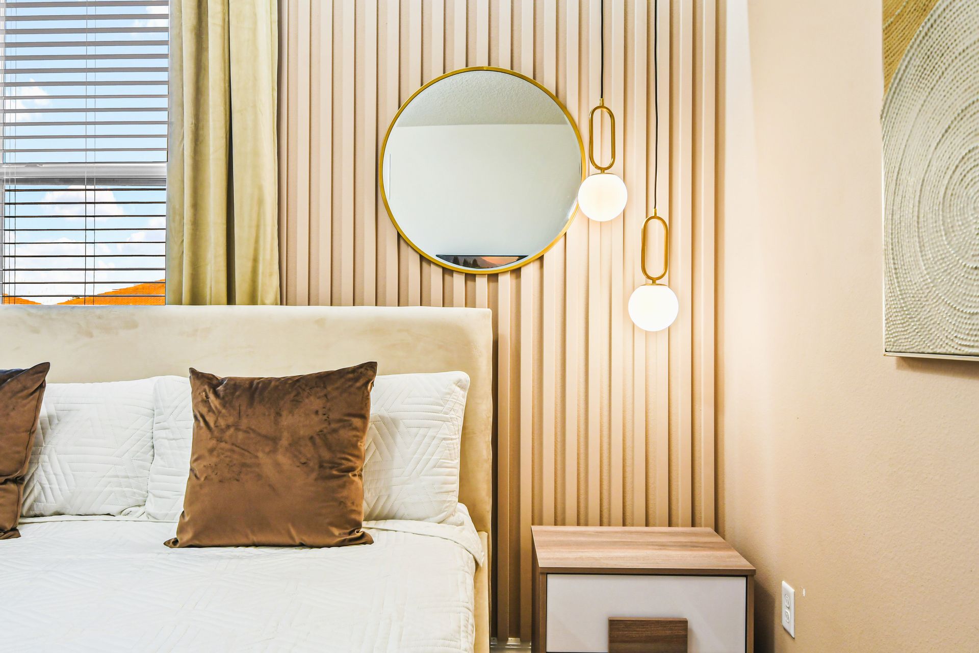 Modern bedroom with warm tones, chic lighting, and elegant decor!