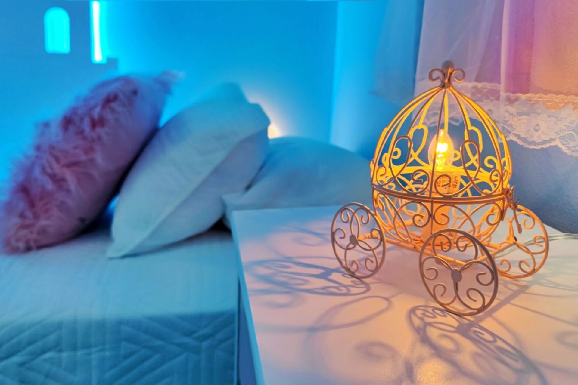 Magical princess-themed room with charming carriage lamp detail!