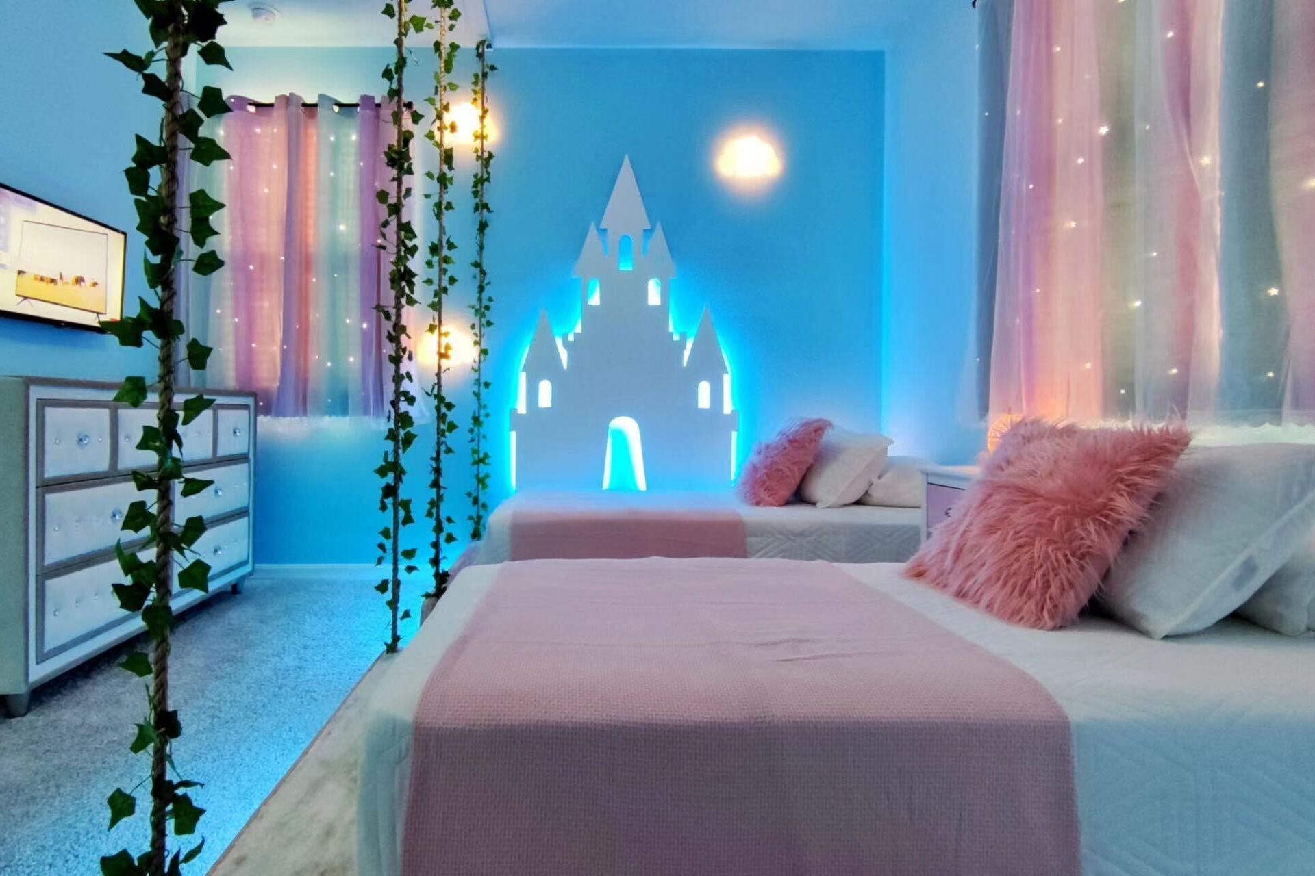 Enchanting fairy-tale room with castle backdrop and glowing decor!