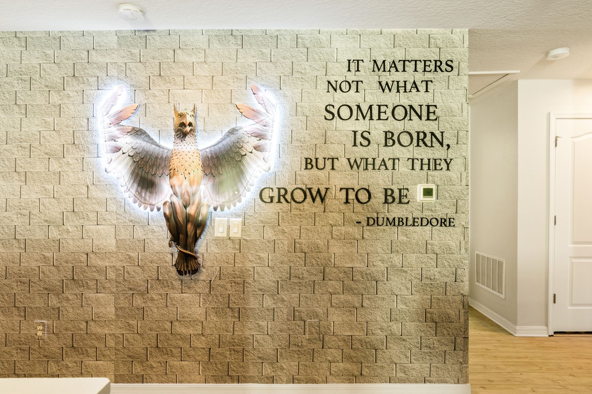 Magical Harry Potter-themed decor with Dumbledore quote and illuminated phoenix.