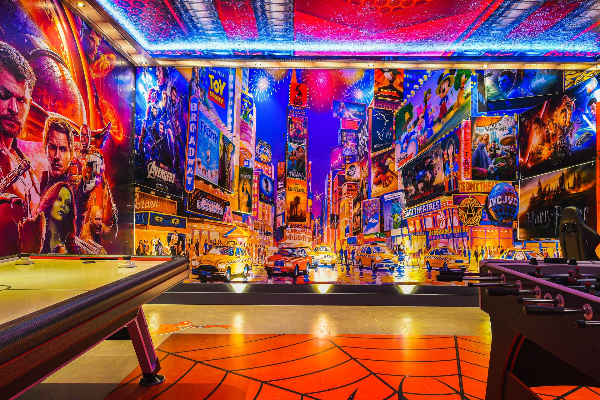 Vibrant game room with air hockey, foosball, and cinematic wall art experience.