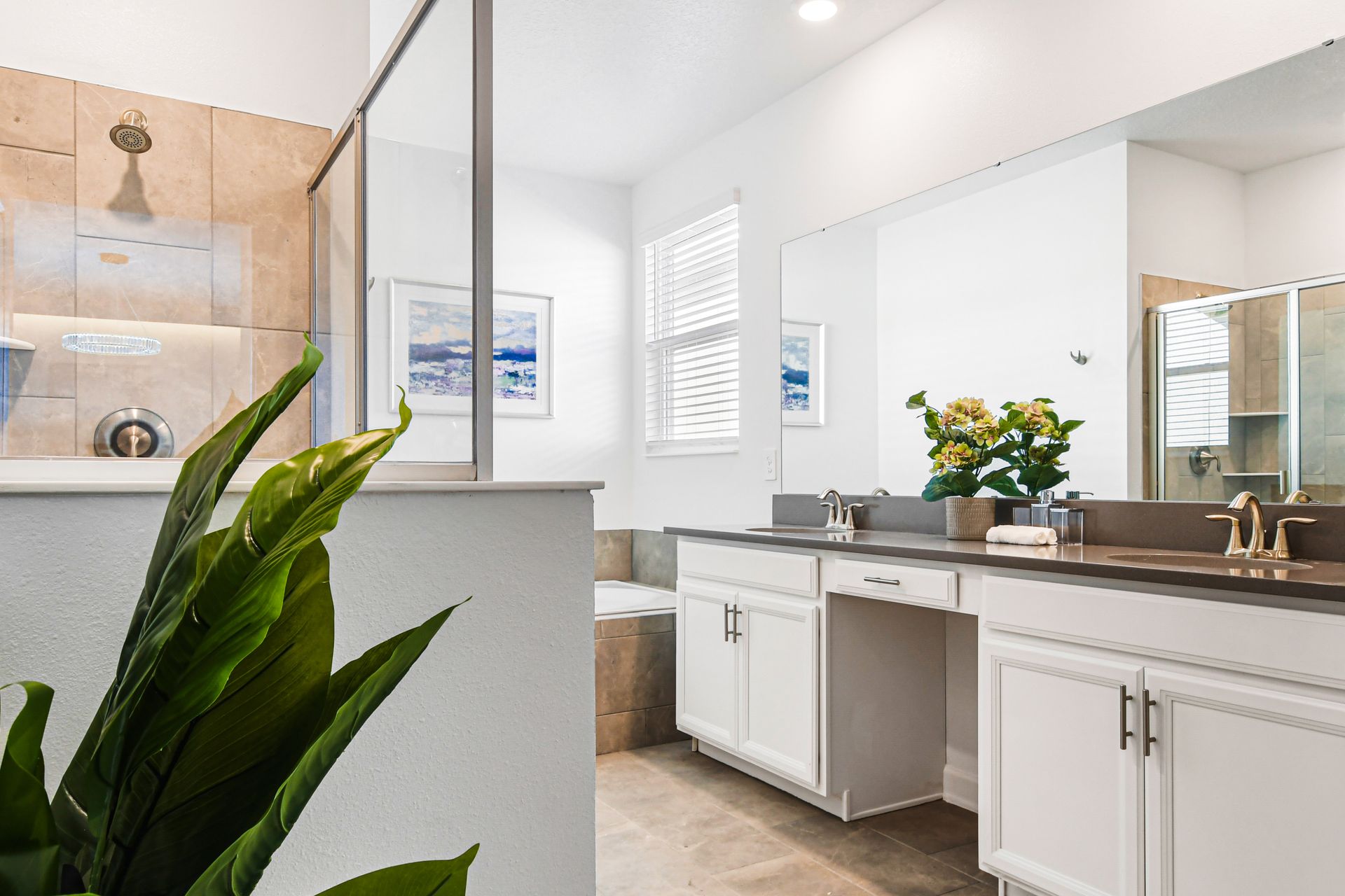 Spacious bath with walk-in shower, garden tub, and dual sink vanity.