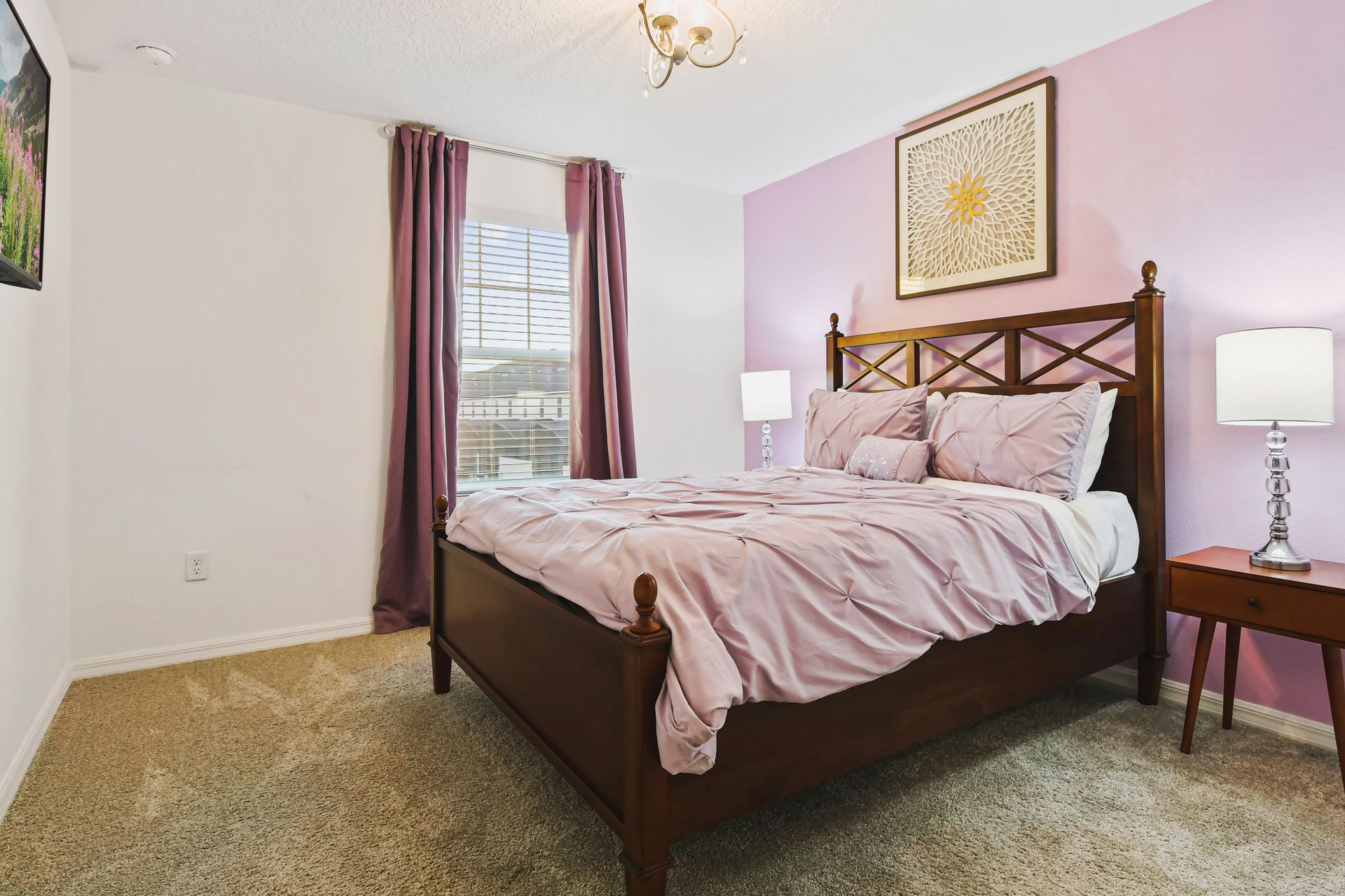 Charming bedroom with soft lavender tones, cozy bedding, and warm lighting.