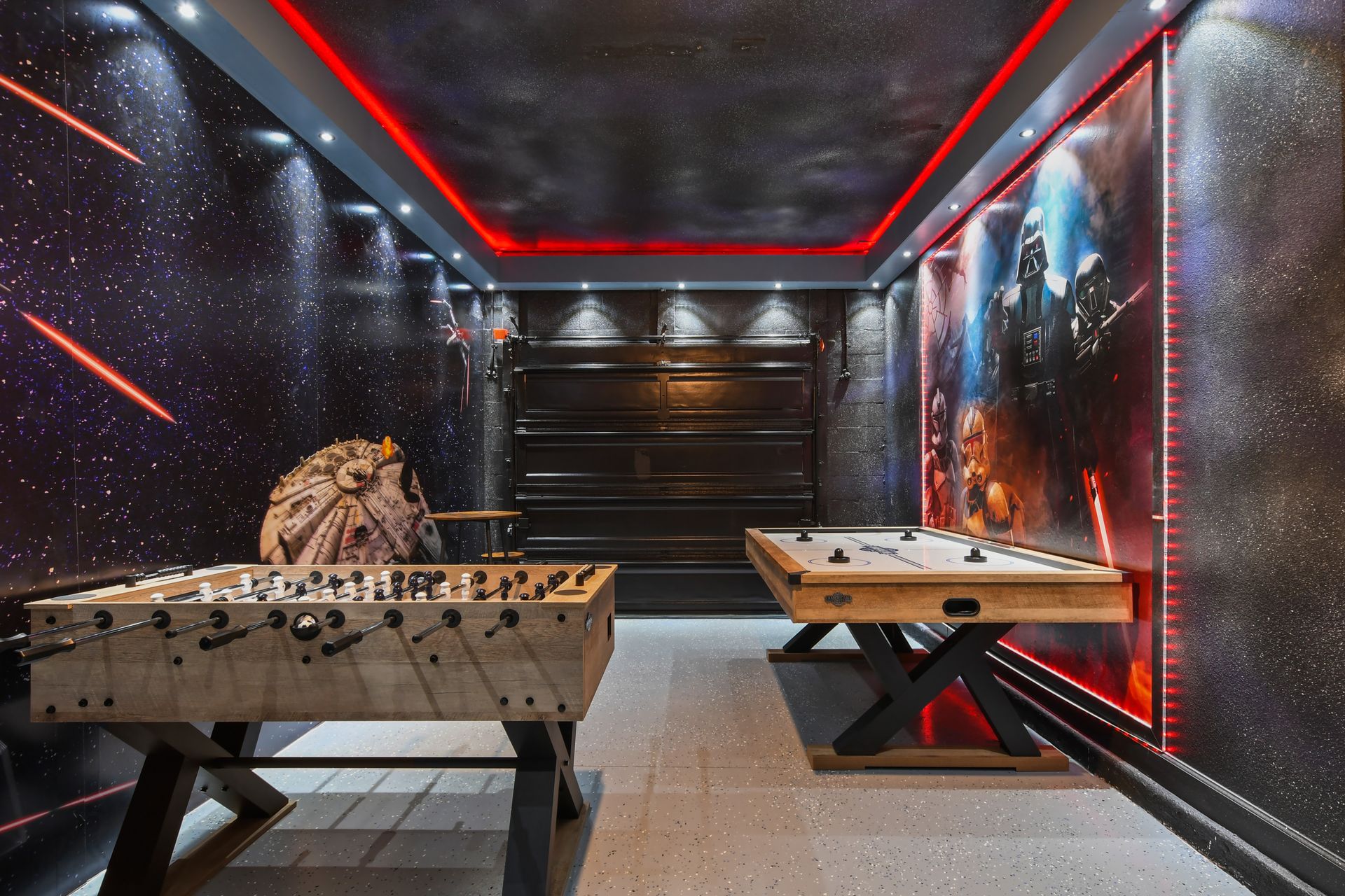 Galactic game room with Star Wars flair, air hockey, foosball, and arcade fun.