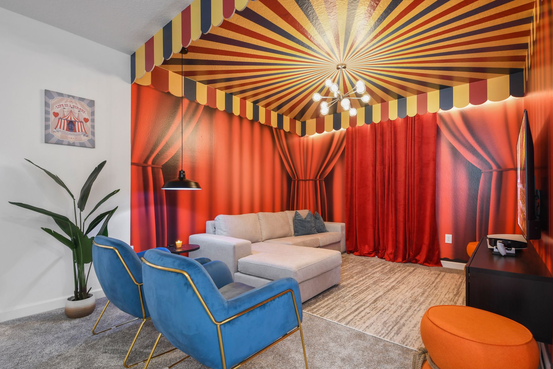 Whimsical circus-themed lounge with bold colors, cozy seating, and fun flair.