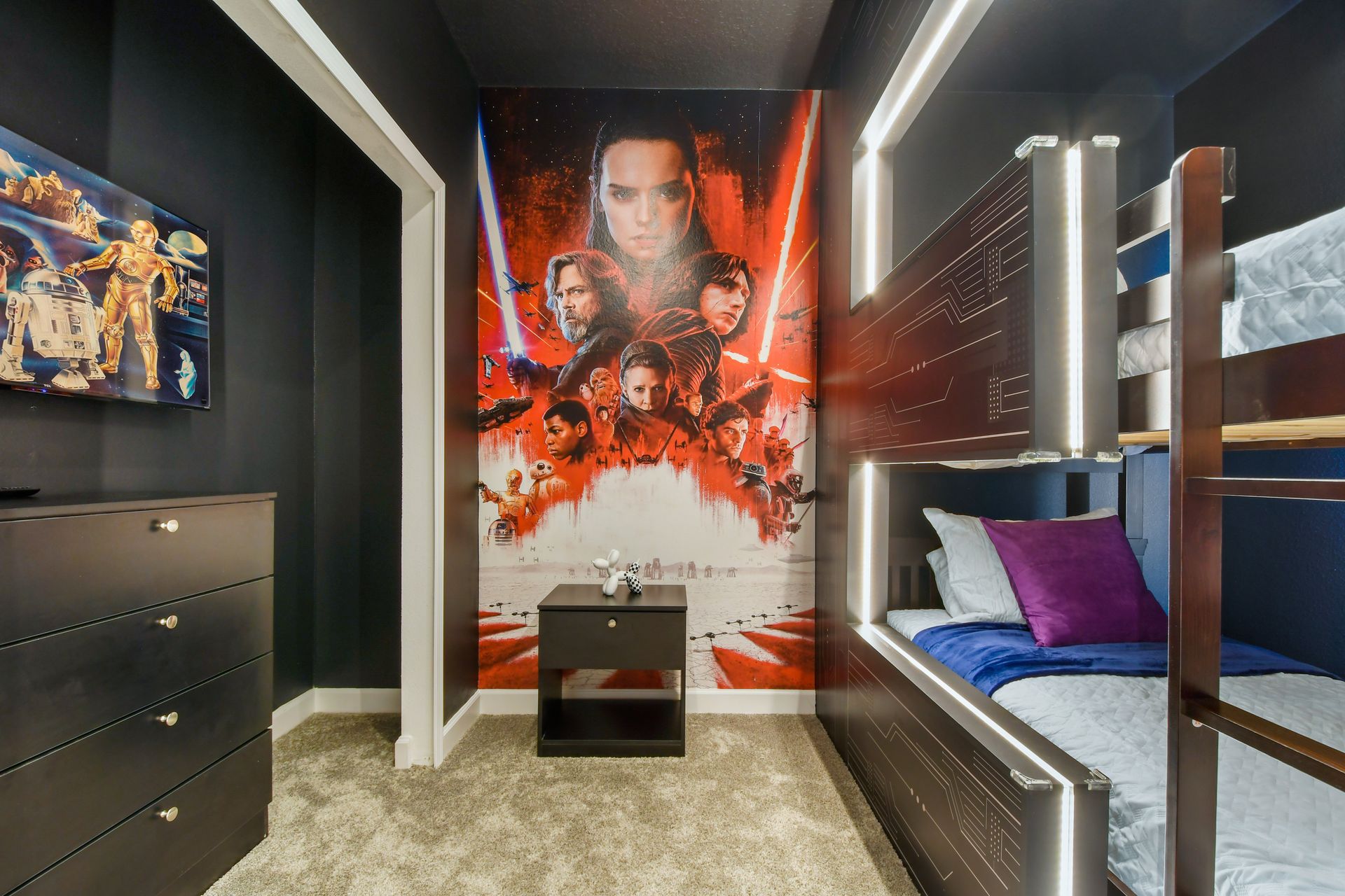 Epic Star Wars bunk room with glowing lights, bold murals, and galactic energy.