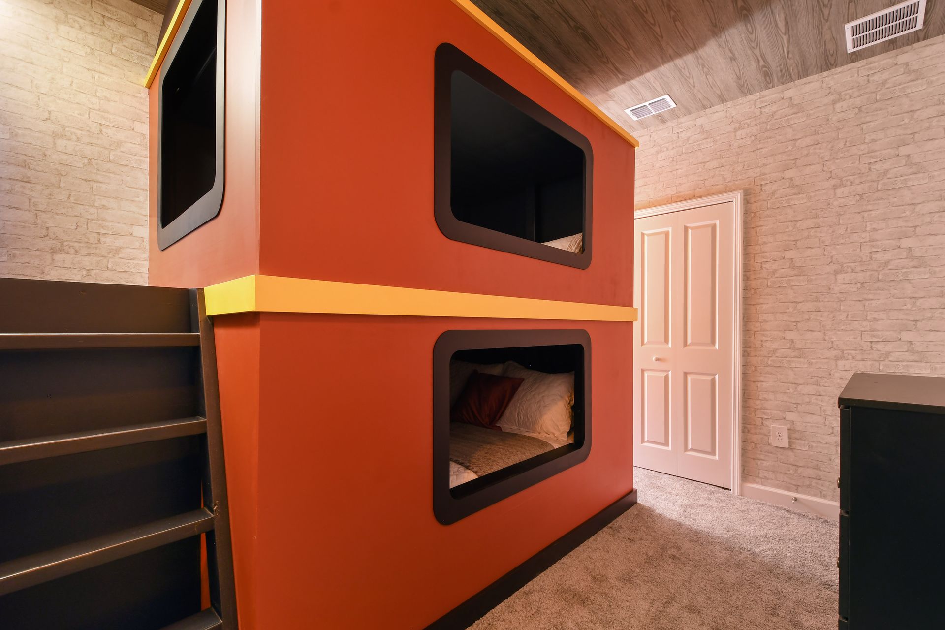 Magical train-themed bunk room with cozy sleeping pods and wizarding world charm.