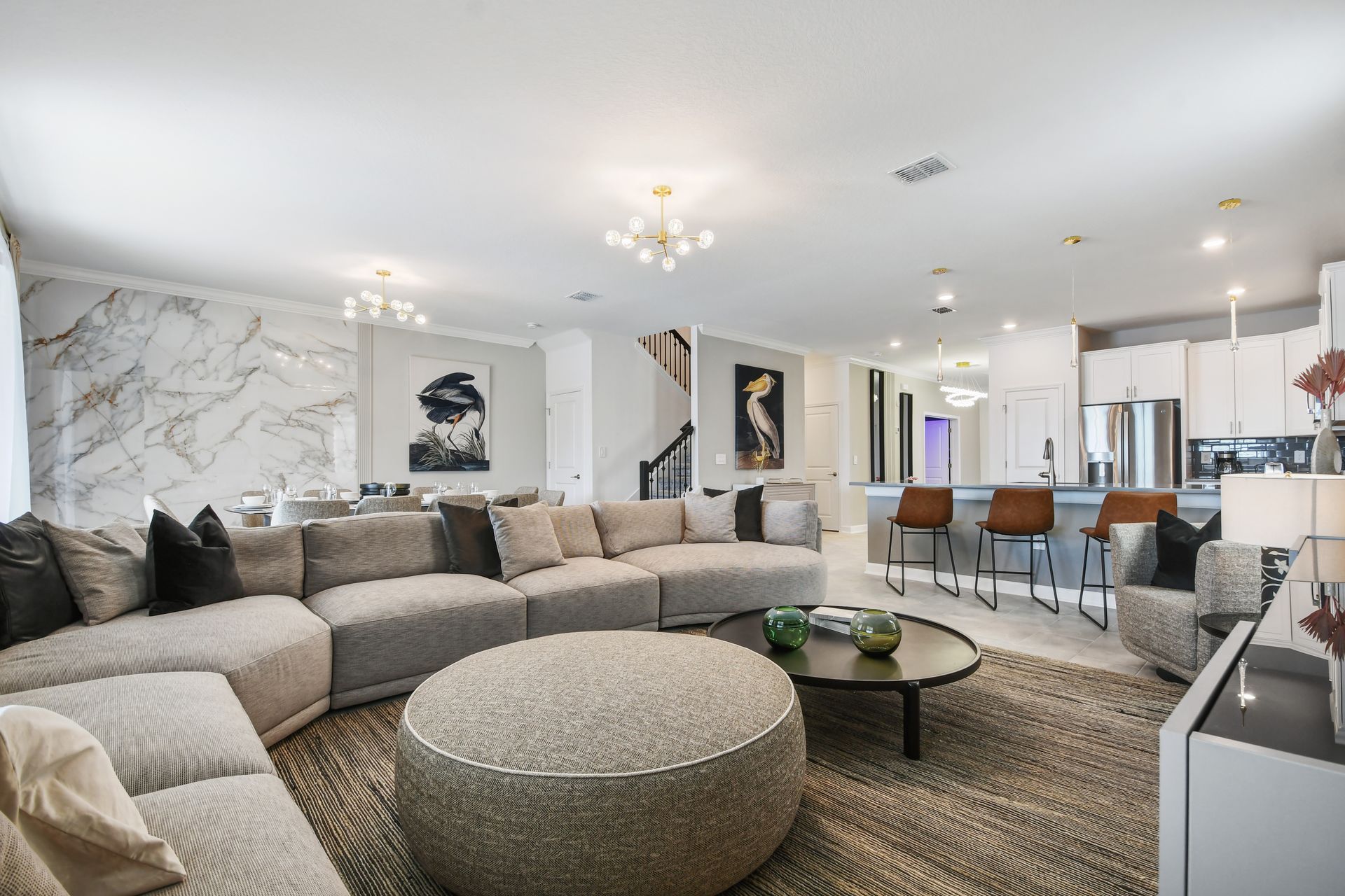 Chic open-concept living with designer touches and luxe marble accents throughout.