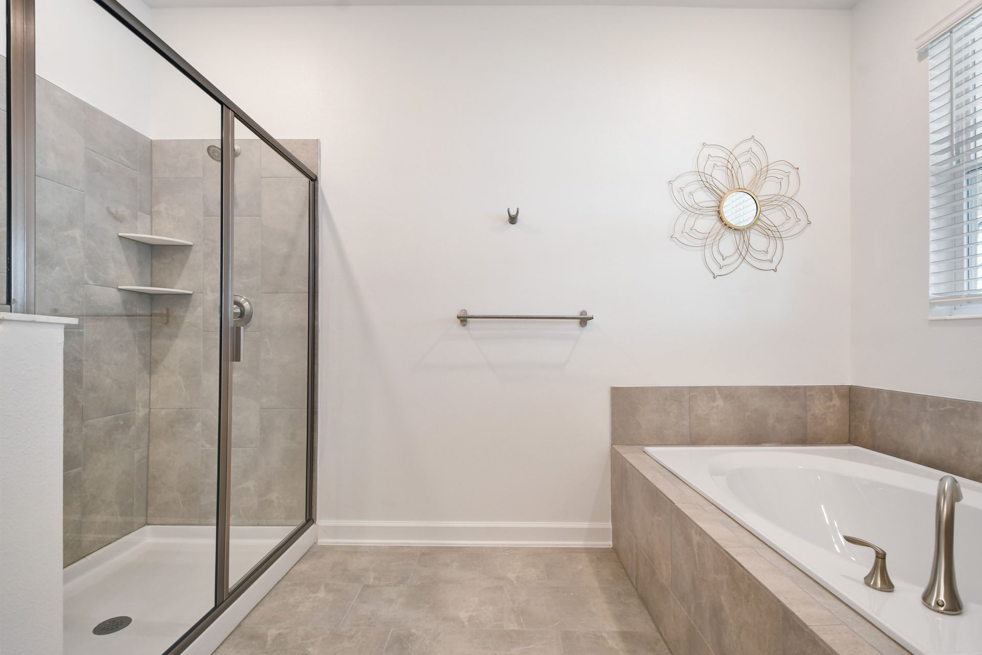 Unwind in style with a soaking tub, walk-in shower, and serene spa-inspired design.