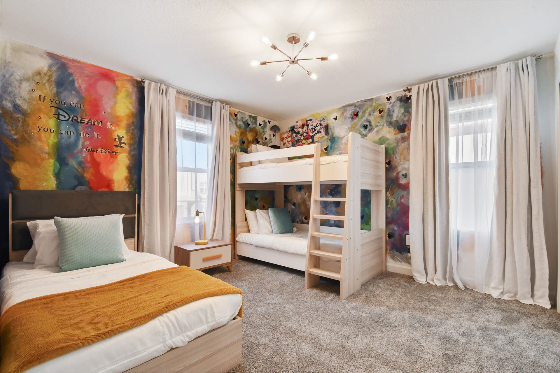Whimsical Disney-inspired room with bunk beds, vibrant murals, and cozy vibes.