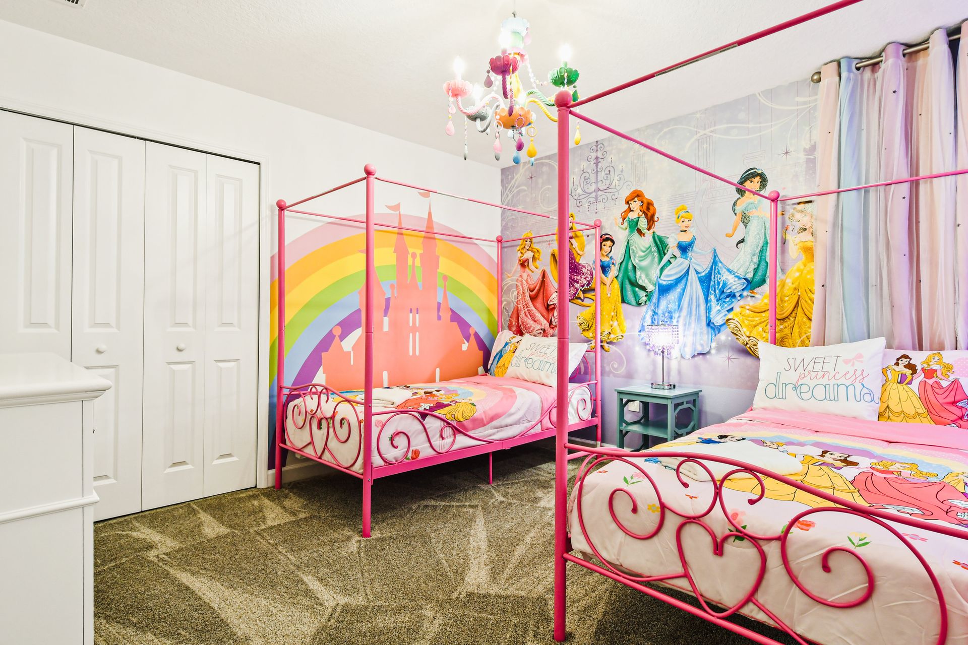 Magical princess room with rainbow castle, canopy beds, and fairy-tale sparkle.