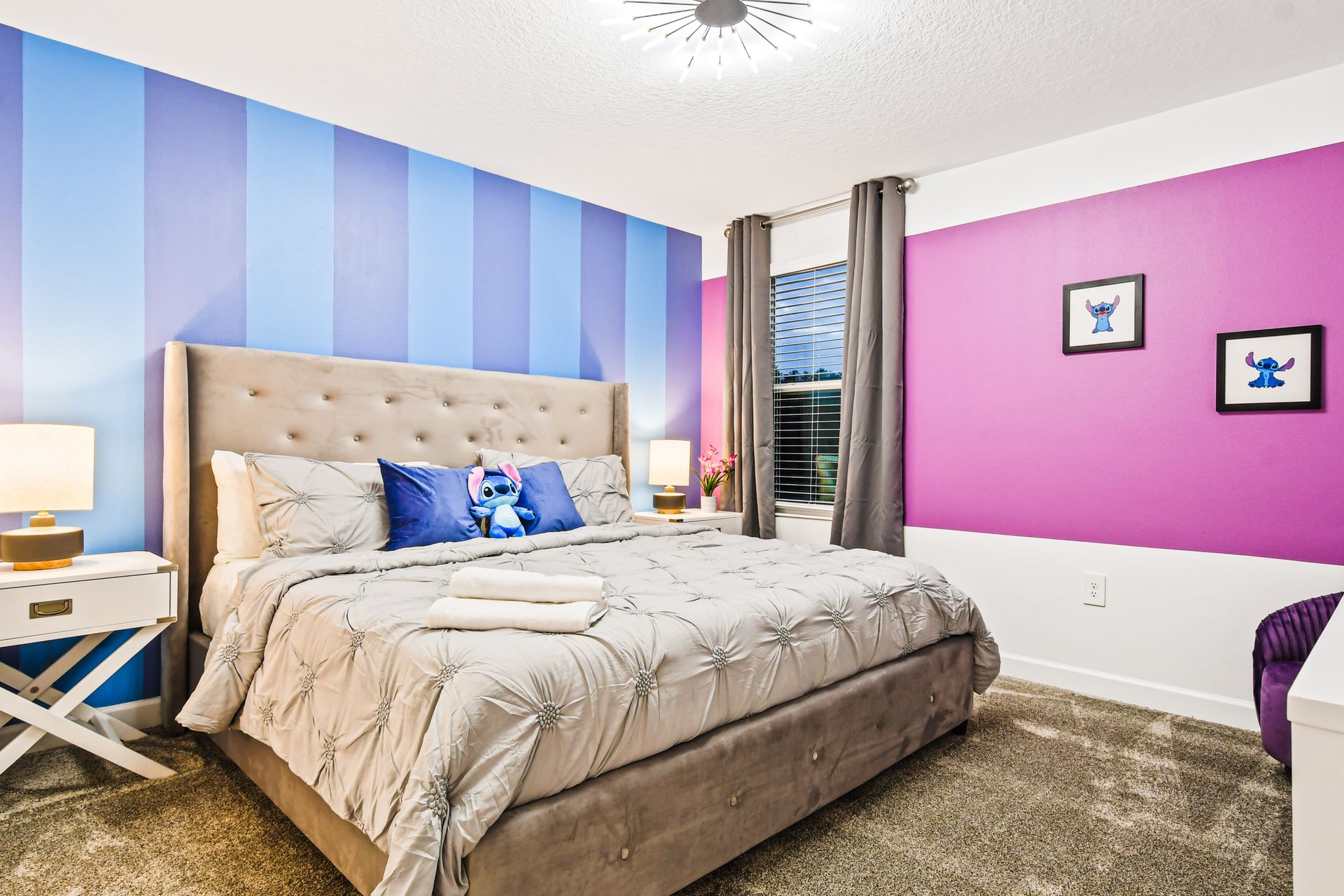 Bright and playful Stitch-themed room with bold colors and cozy king bed.