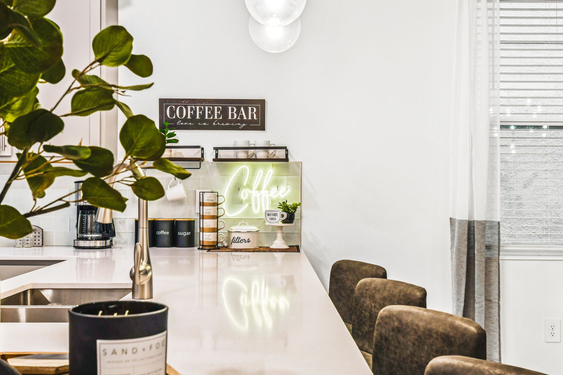 Chic coffee bar setup with neon sign, cozy vibes, and all the essentials.