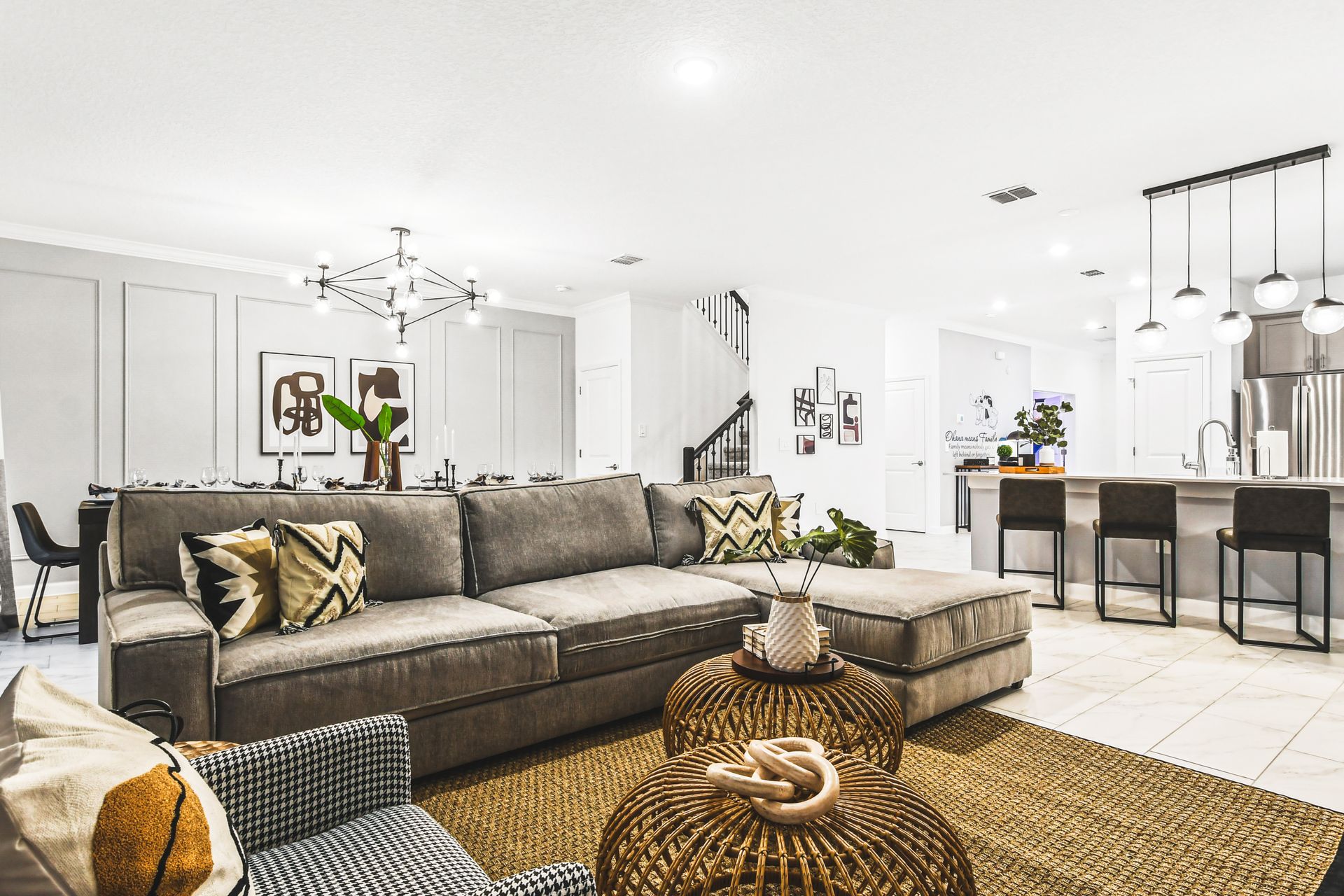 Stylish open-concept living with luxe seating, modern kitchen, and sleek decor.