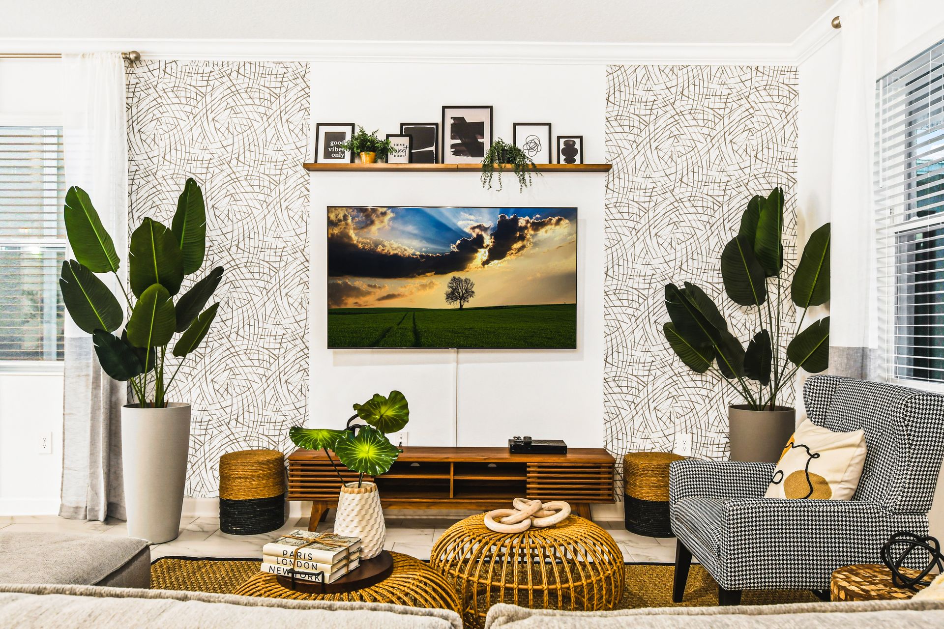 Cozy living space with bold greenery, modern accents, and a sleek TV setup.