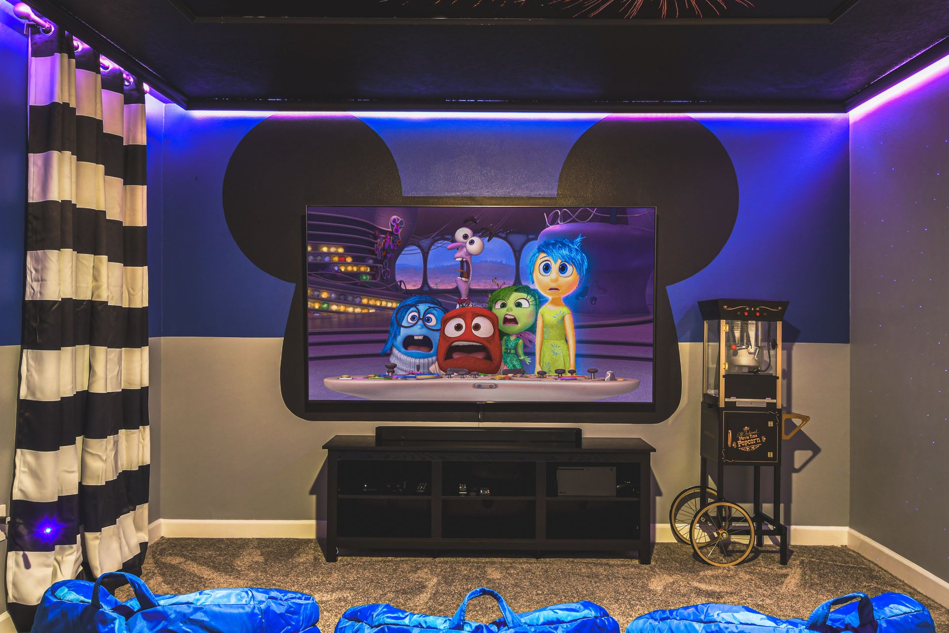 Disney-themed home theater with cozy recliners, movie posters, and magical vibes.