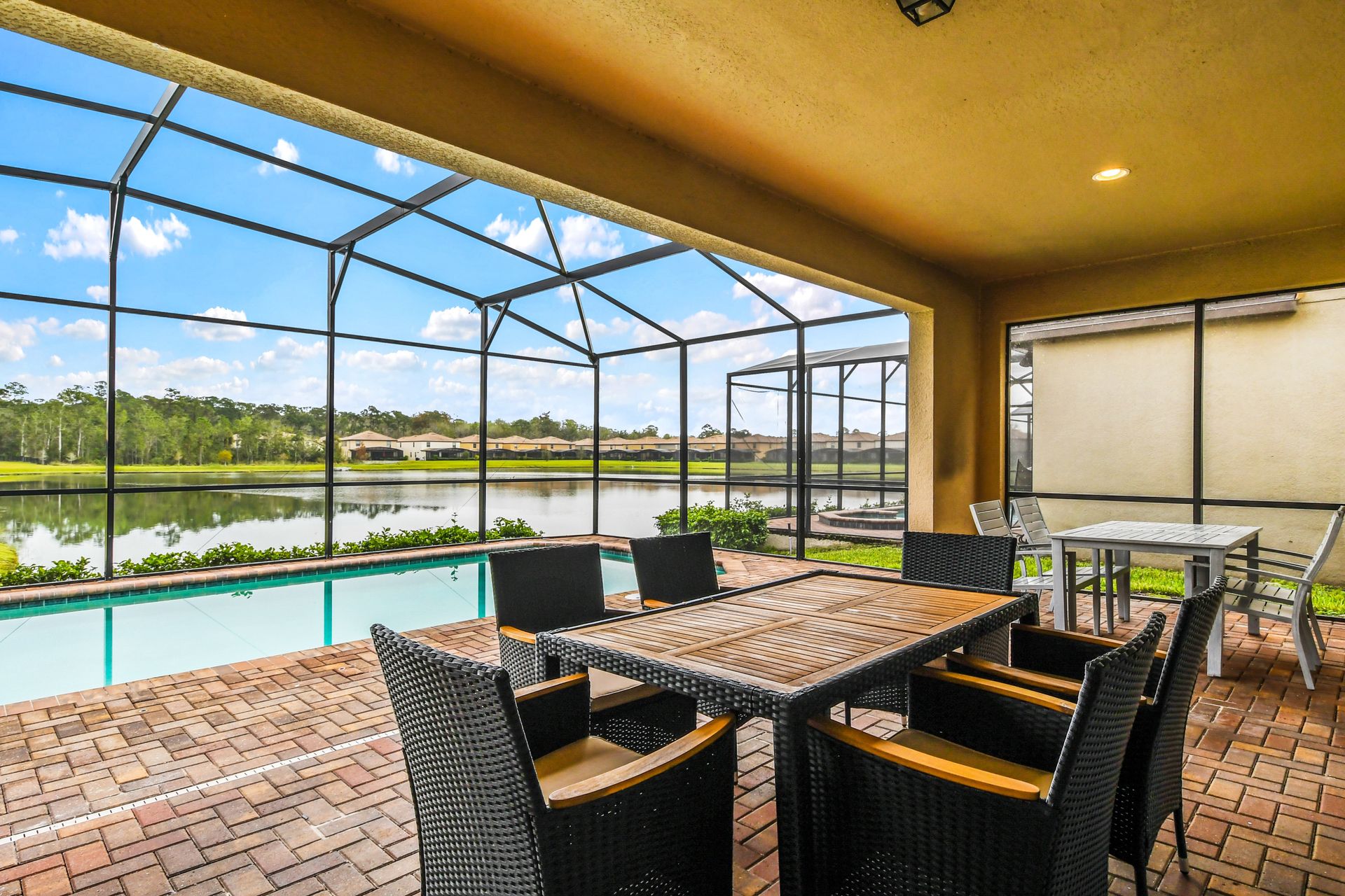 Screened Pool & Spa: Enjoy a private oasis with a screened pool and spa for a serene and refreshing retreat