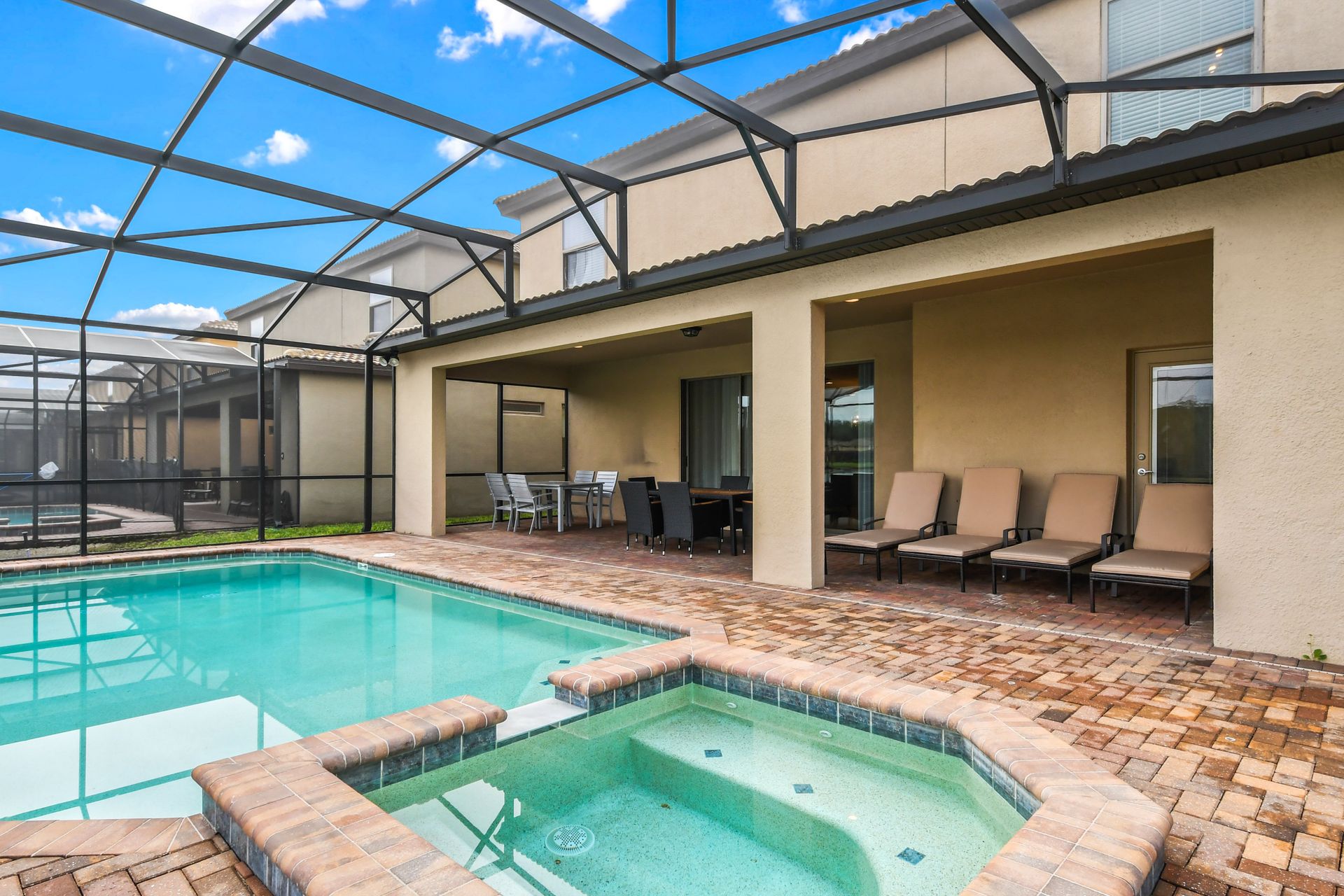 Screened Pool & Spa: Enjoy a private oasis with a screened pool and spa for a serene and refreshing retreat