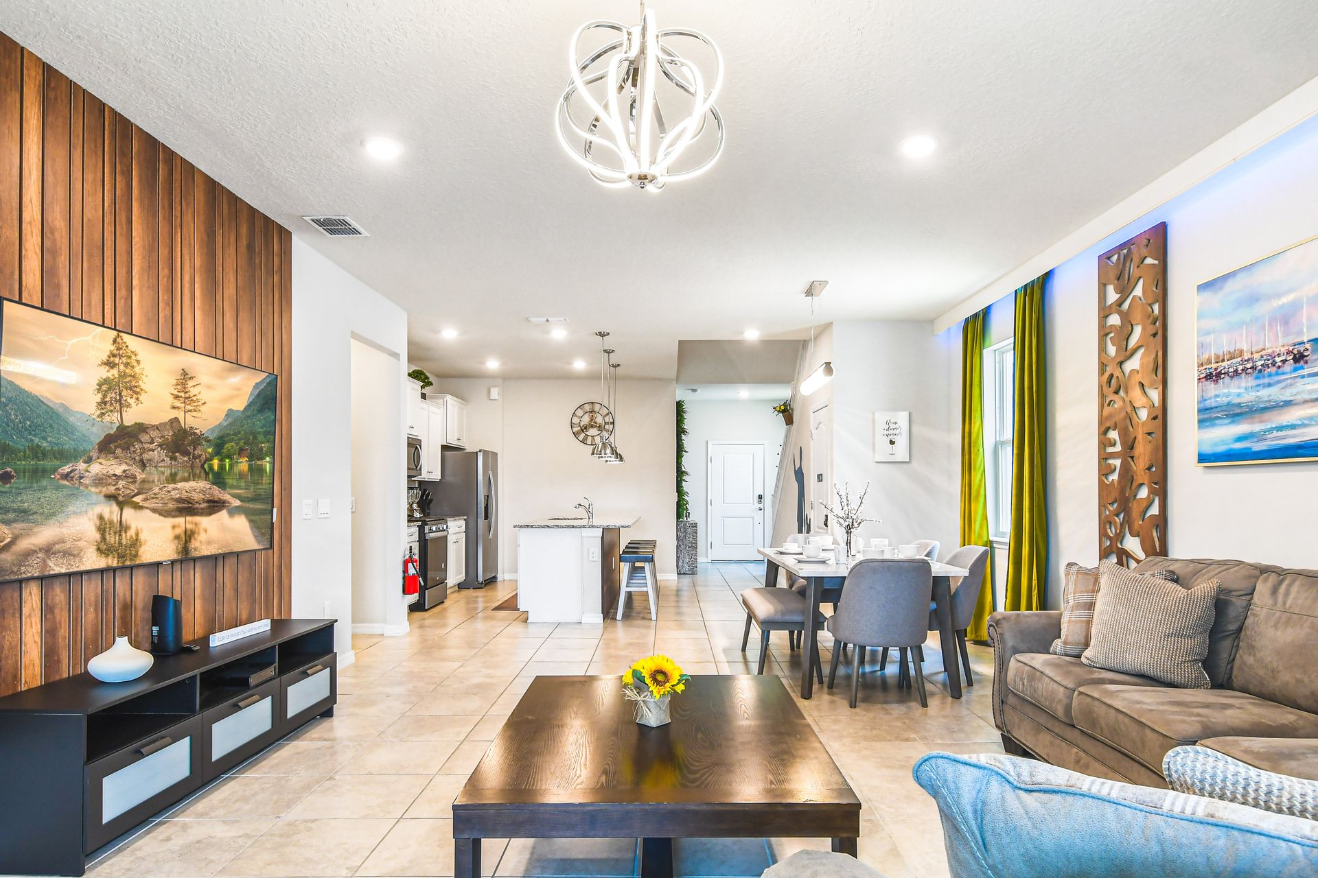 Roomy living area embelished with a comfortable sofa - perfect for creating a warm and inviting atmosphere during a family reunion.